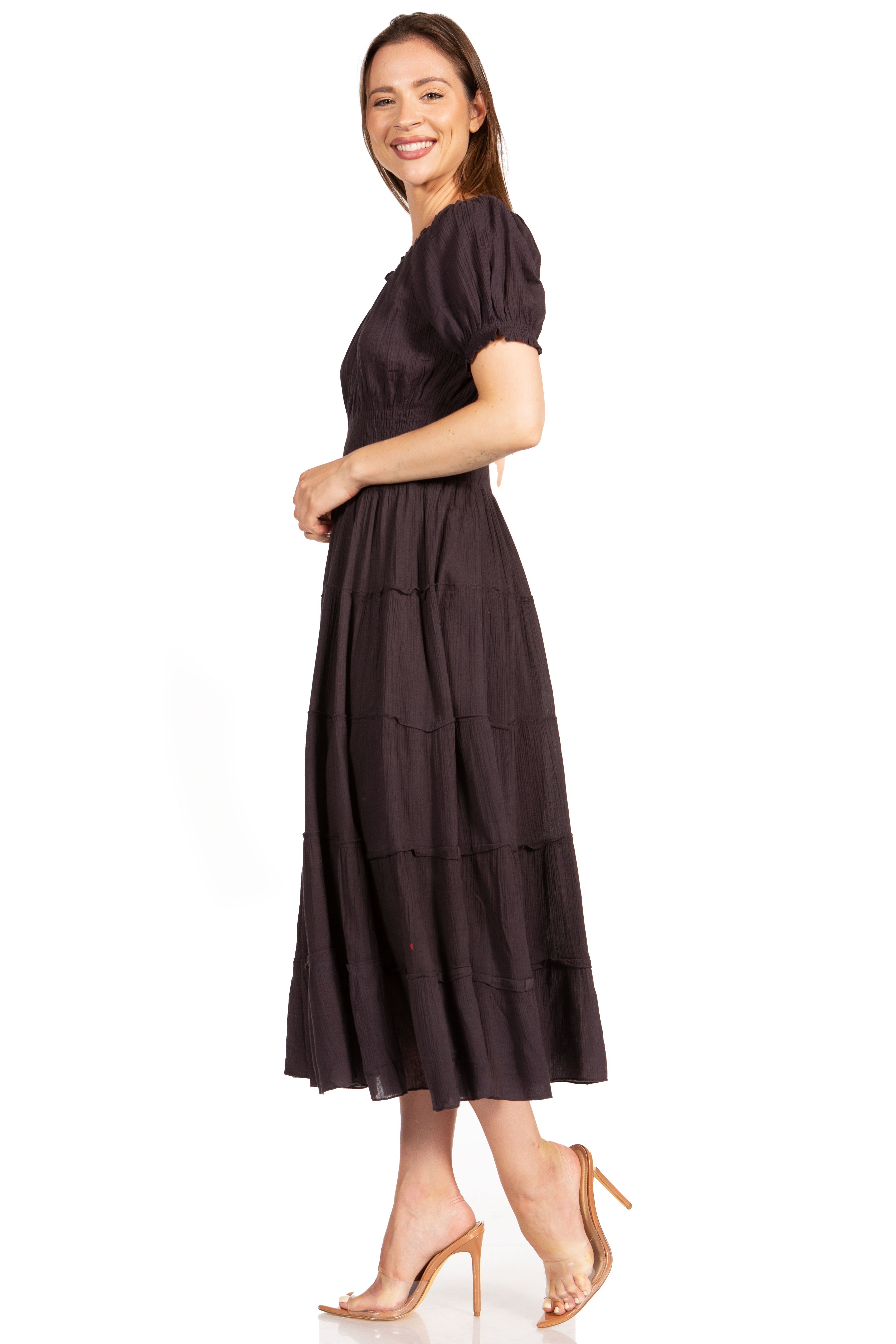 Woman wearing a dark brown dress on a white background