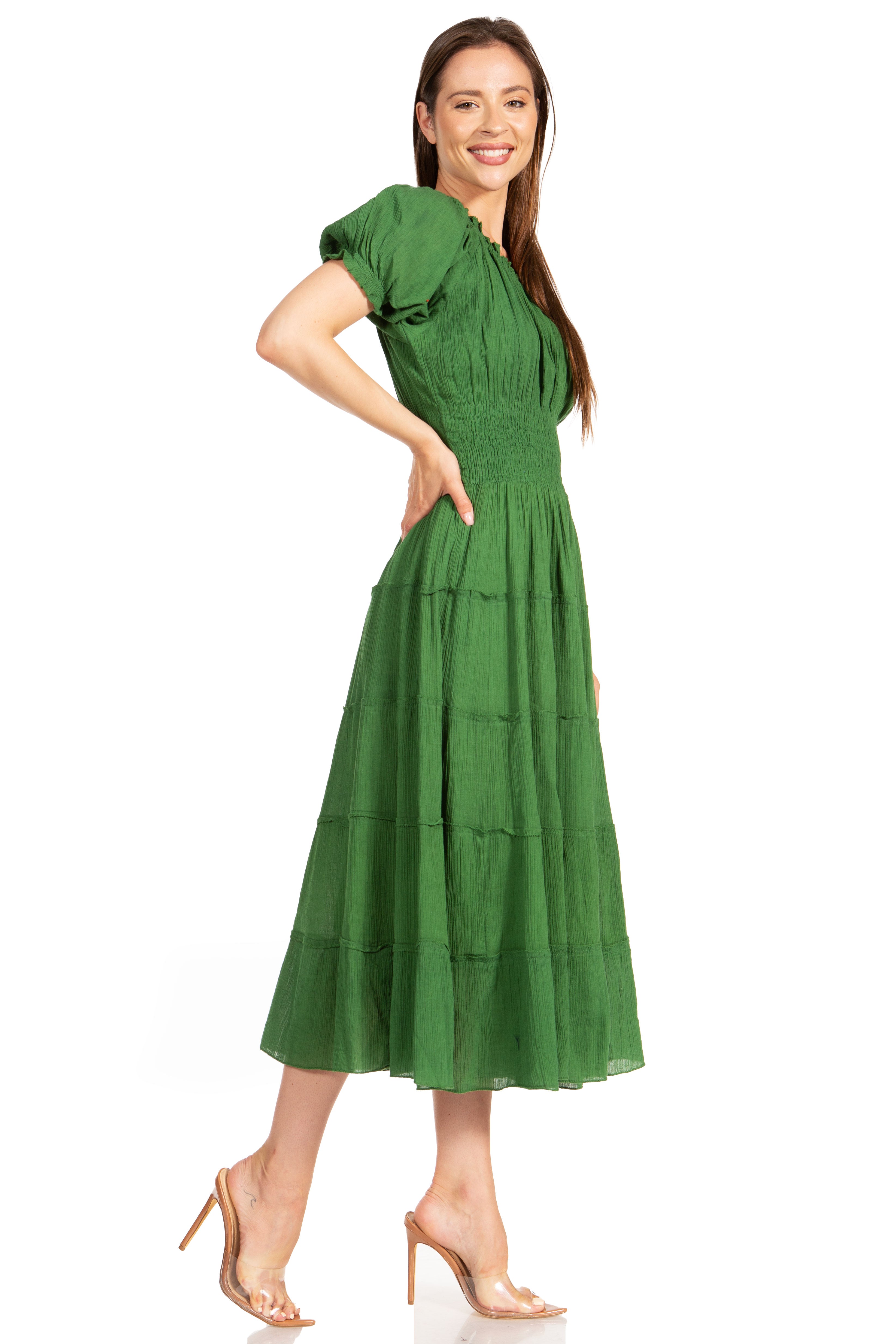 Woman wearing a green dress on a white background