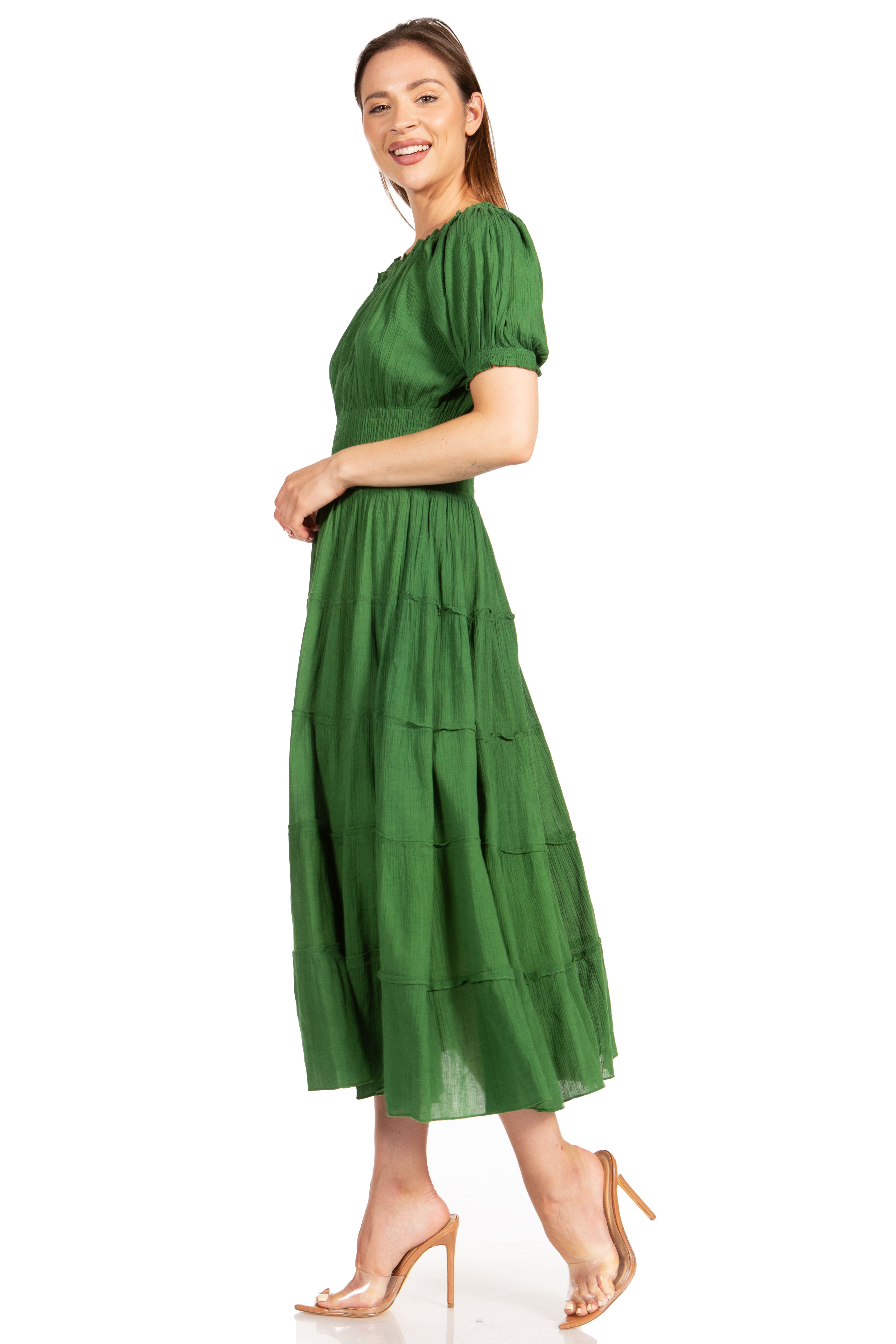 Woman wearing a green dress on a white background