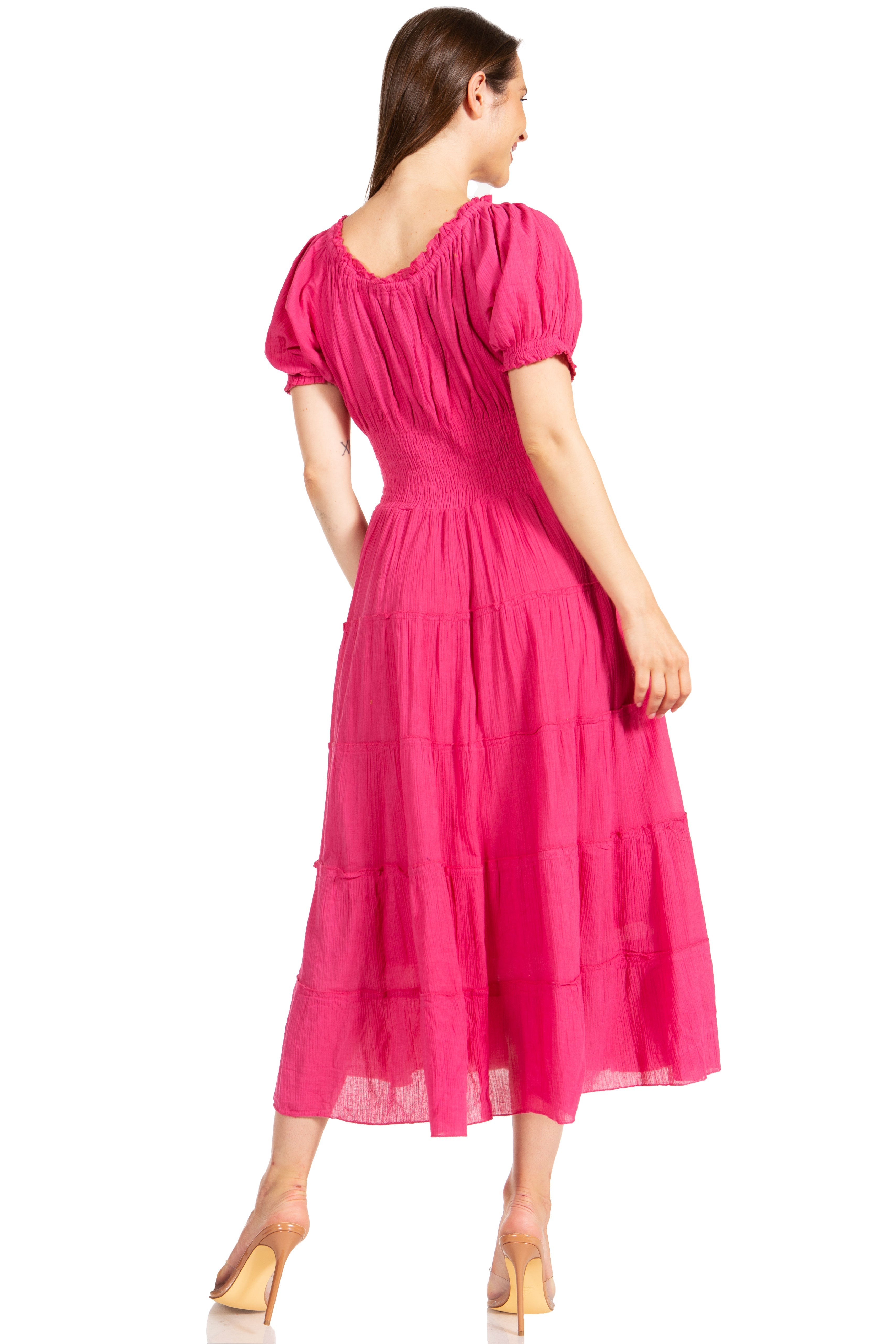 Woman wearing a bright pink dress on a white background