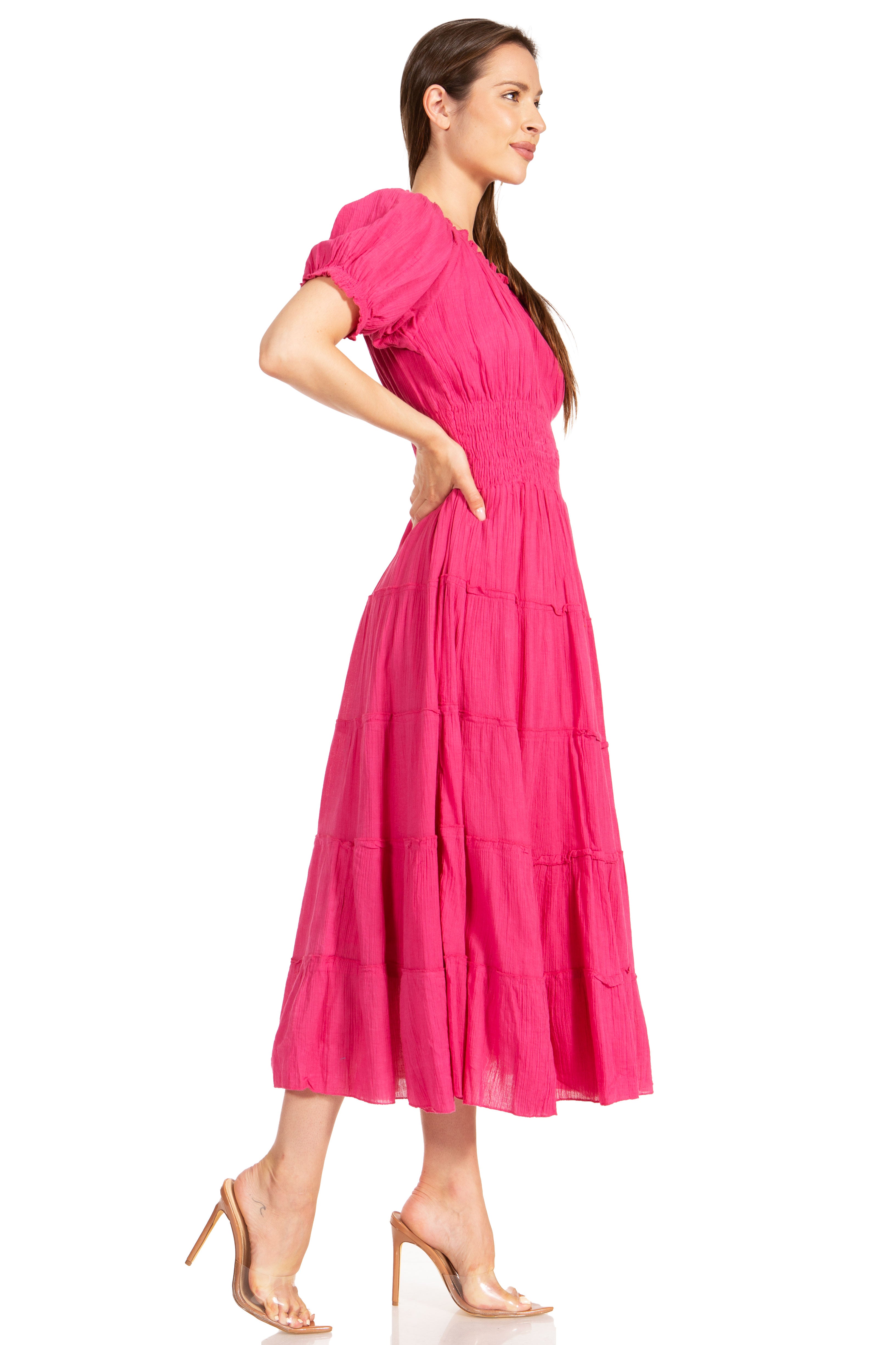 Woman wearing a pink dress on a white background