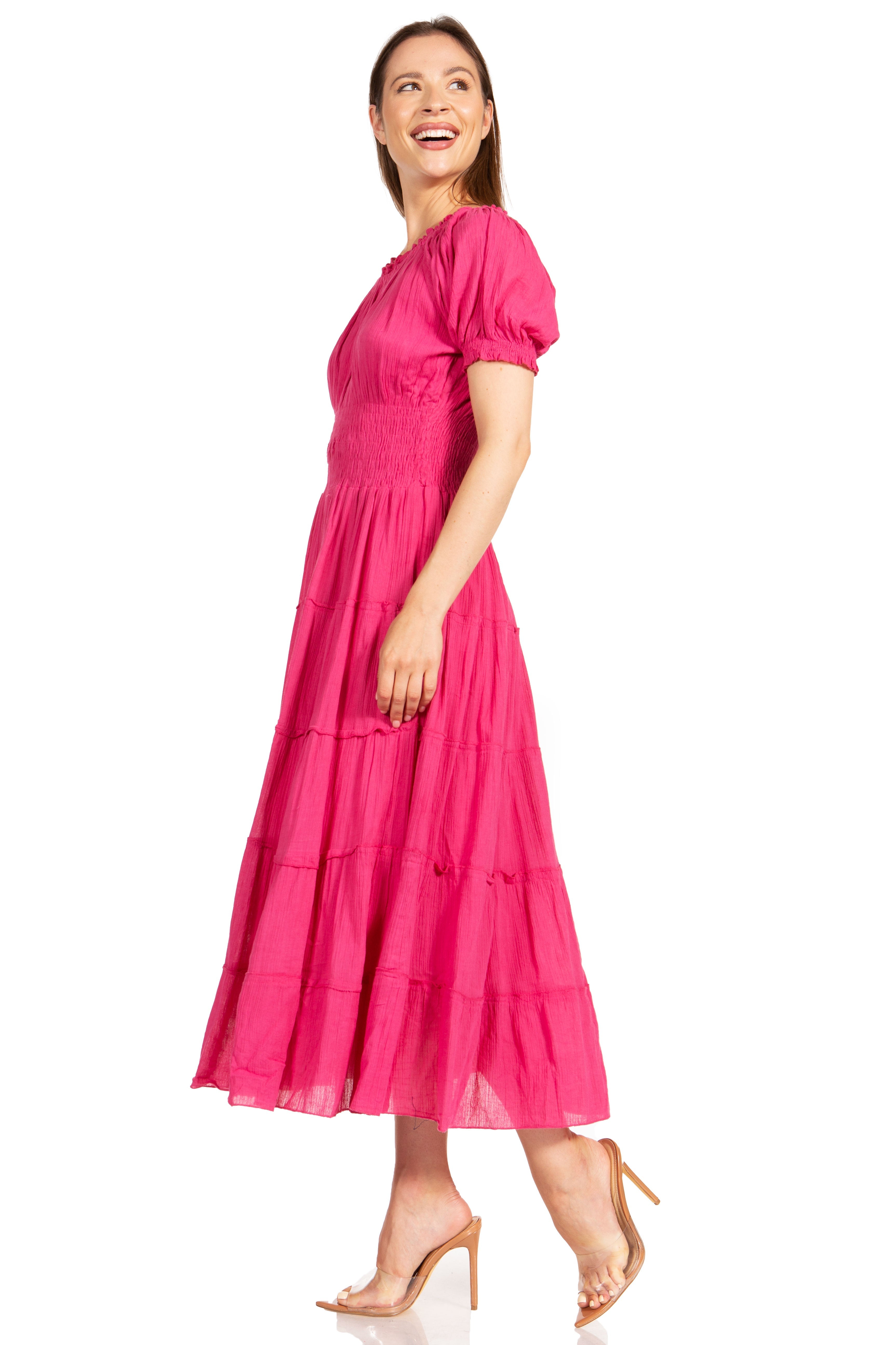 Woman wearing a pink dress on a white background