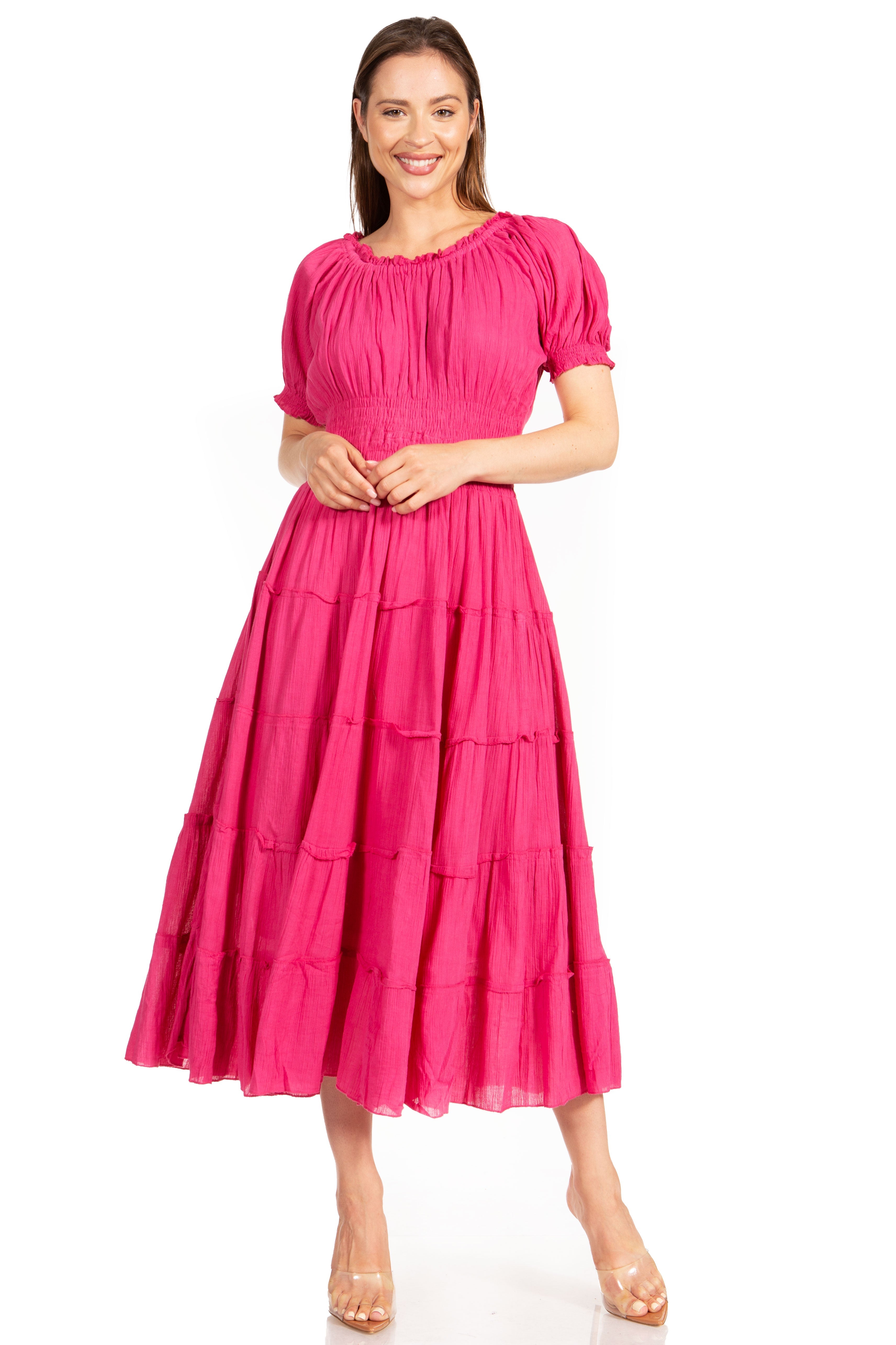 Woman wearing a pink dress on a white background