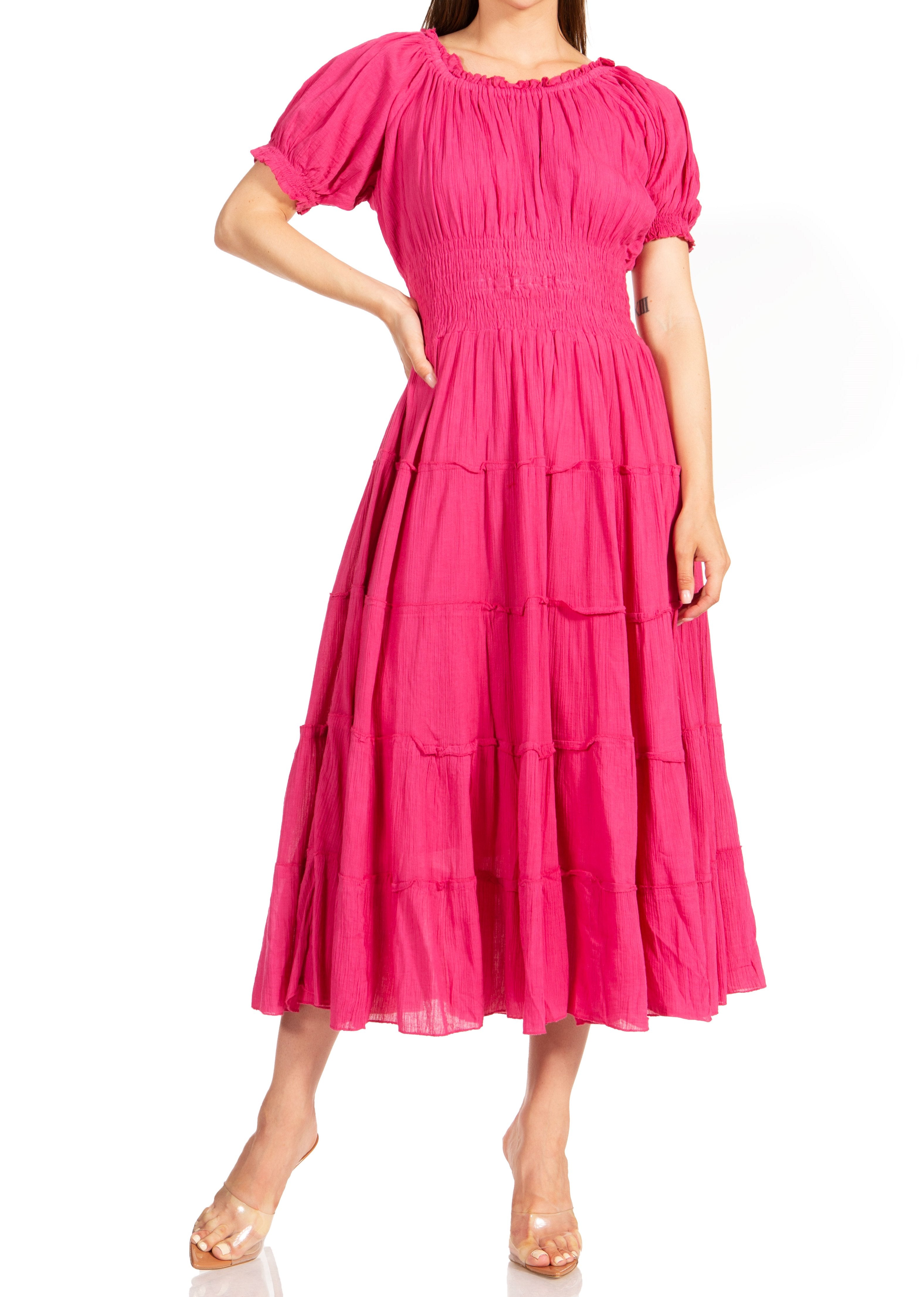 Woman wearing a pink dress on a white background