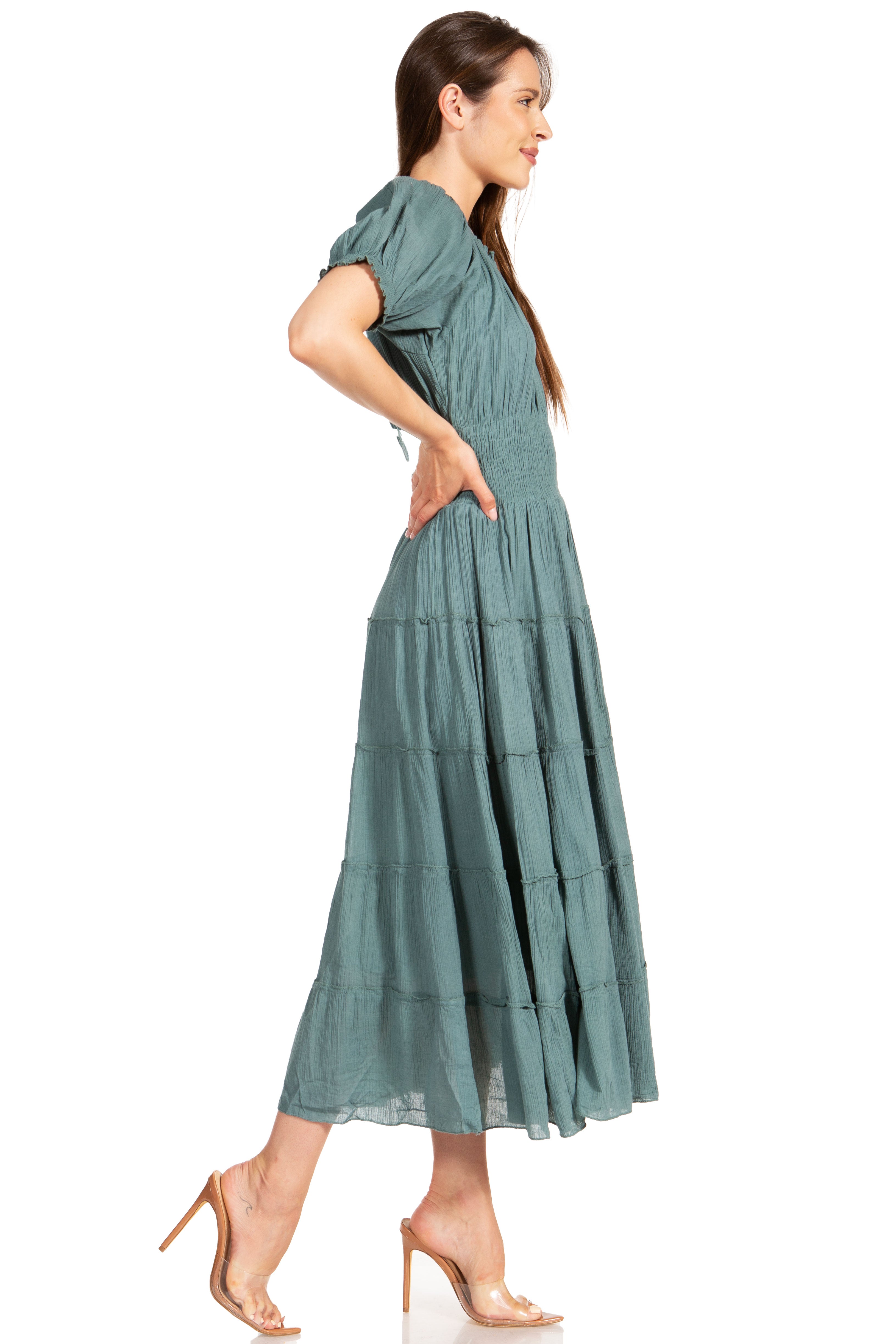 Woman wearing a green dress on a white background