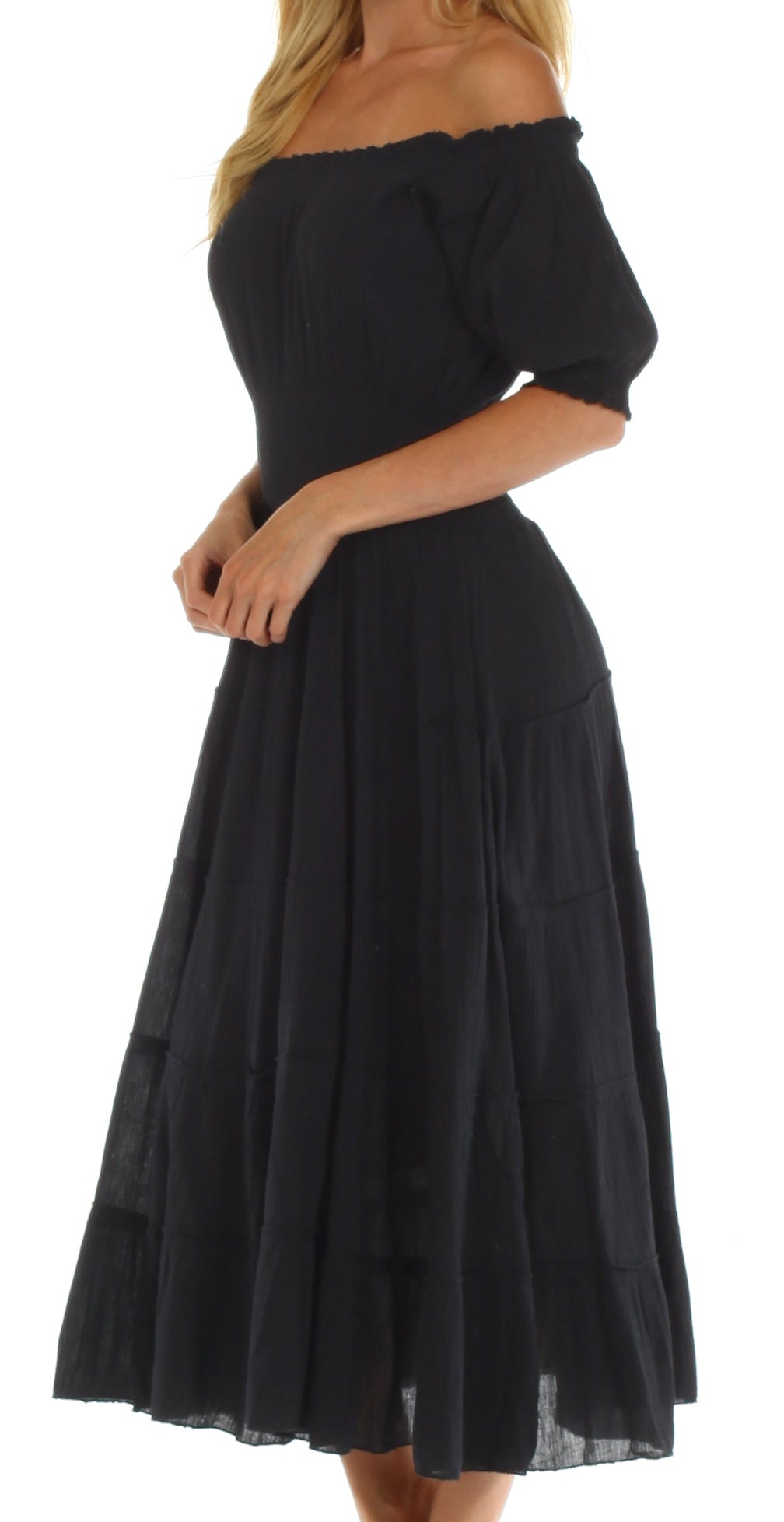 Black off-shoulder dress worn by a person on a white background
