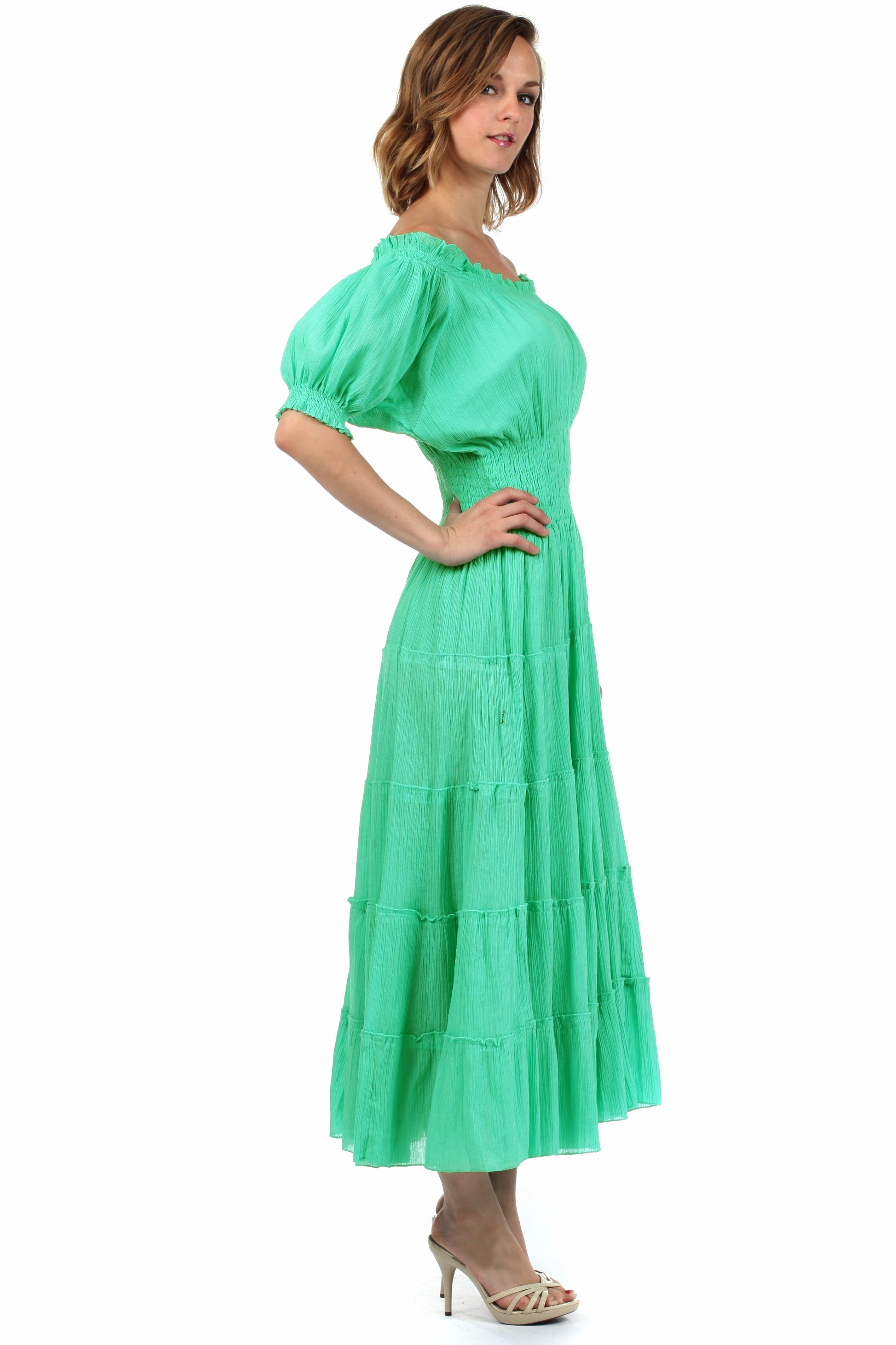 Woman wearing a green dress on a white background