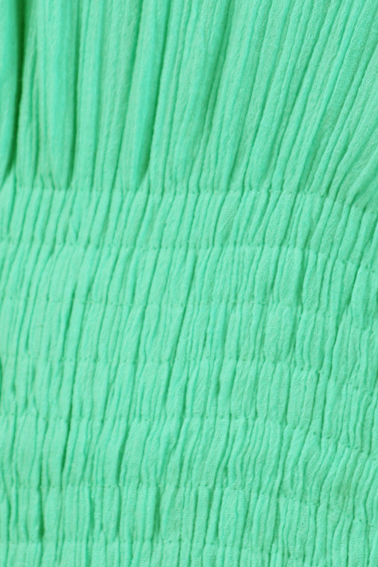 Close-up of textured green fabric