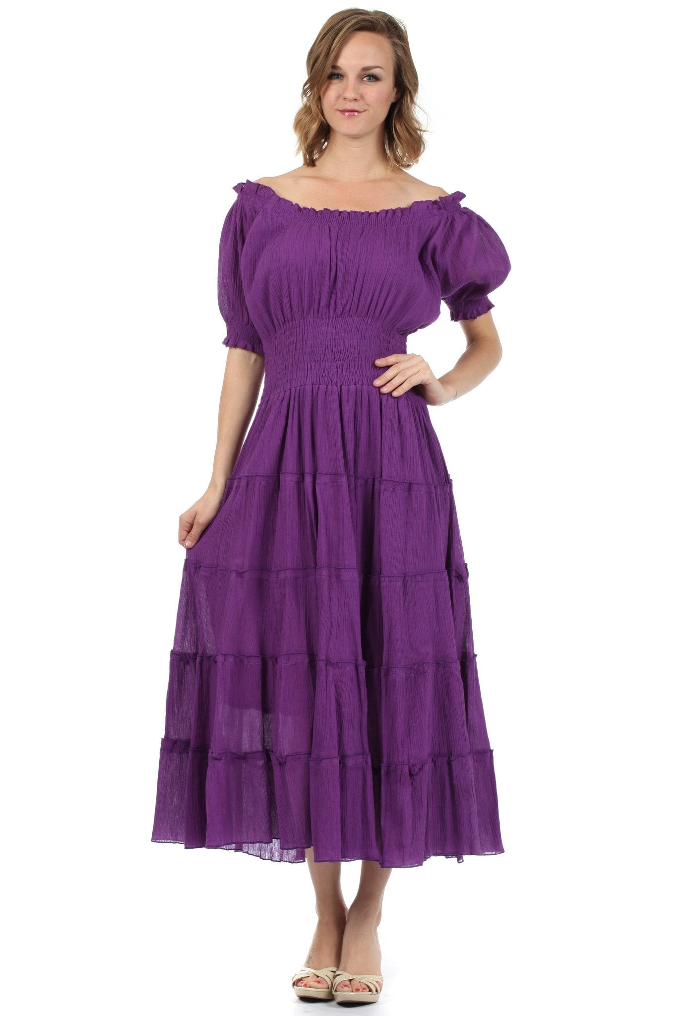 Woman wearing a purple dress with puffed sleeves on a white background