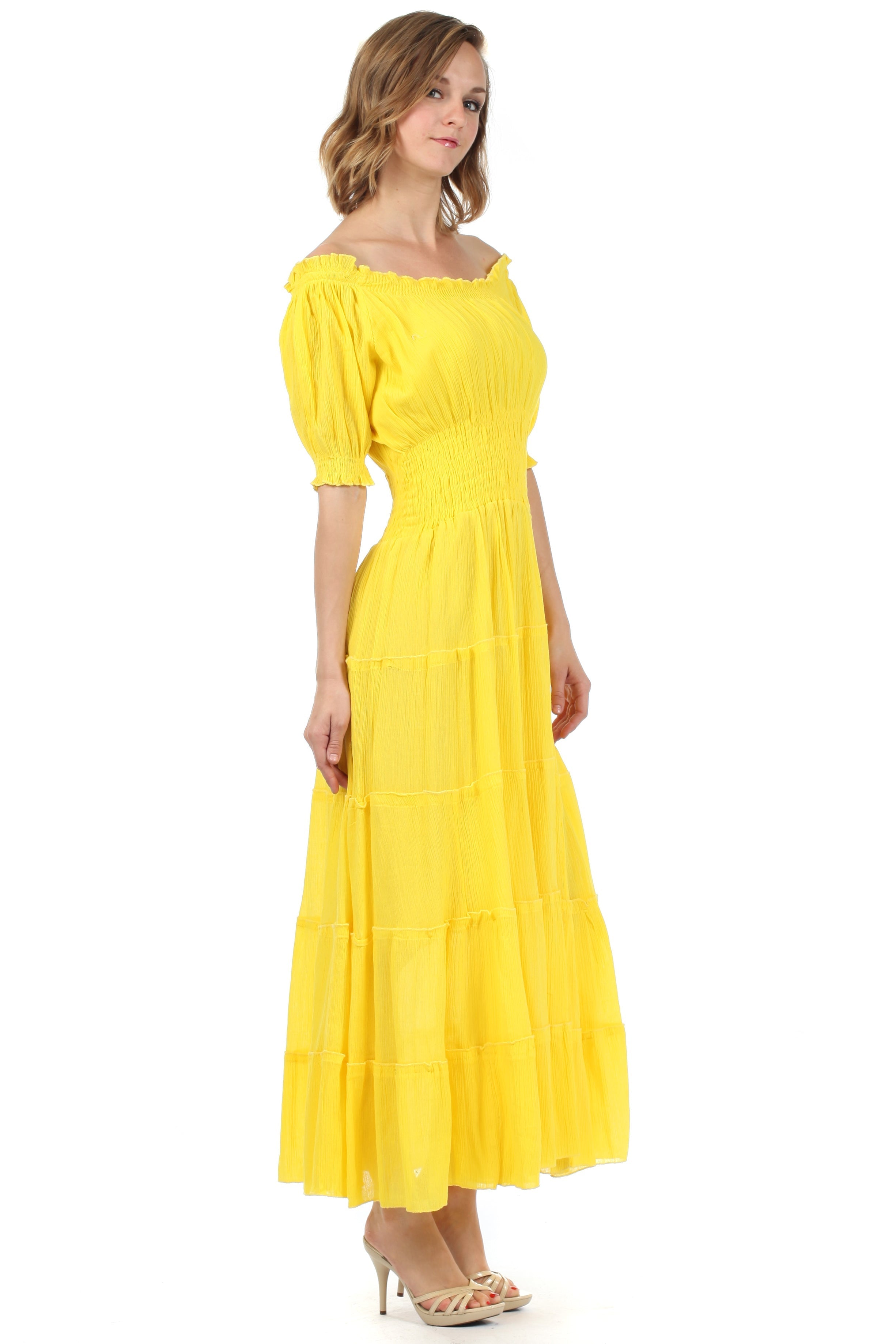 Woman wearing a yellow dress on a white background