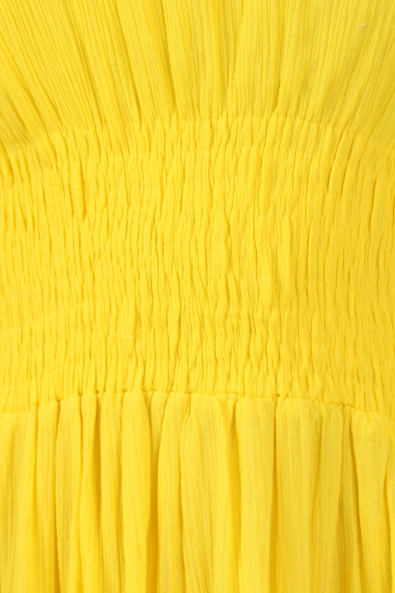 Close-up of a yellow textured fabric