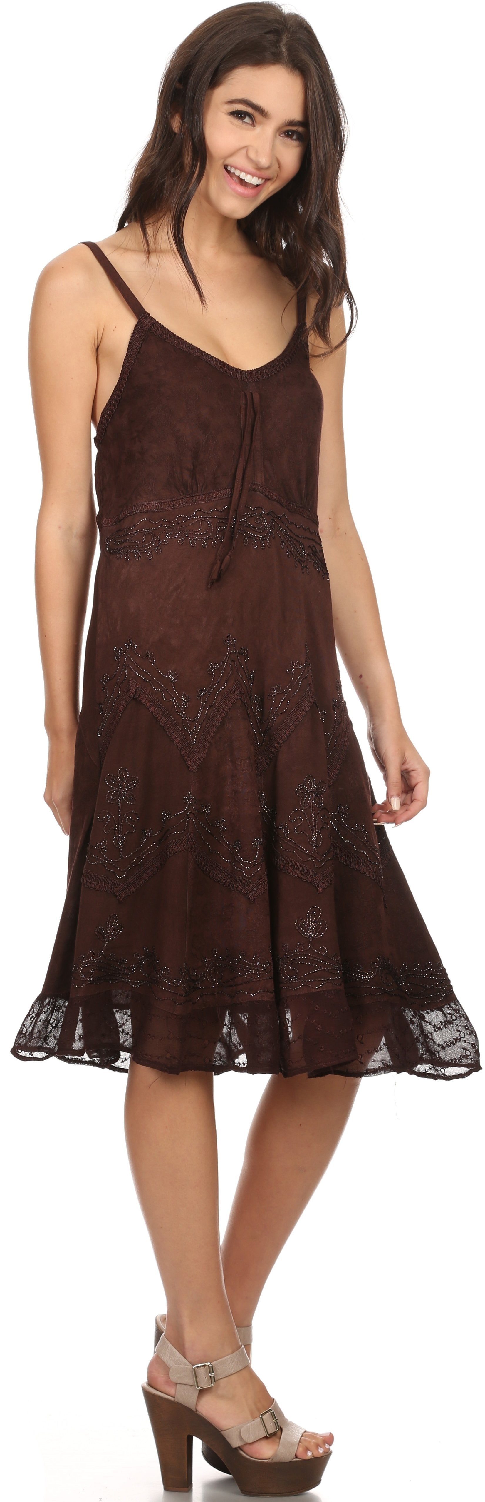 Woman wearing a brown lace dress on a white background