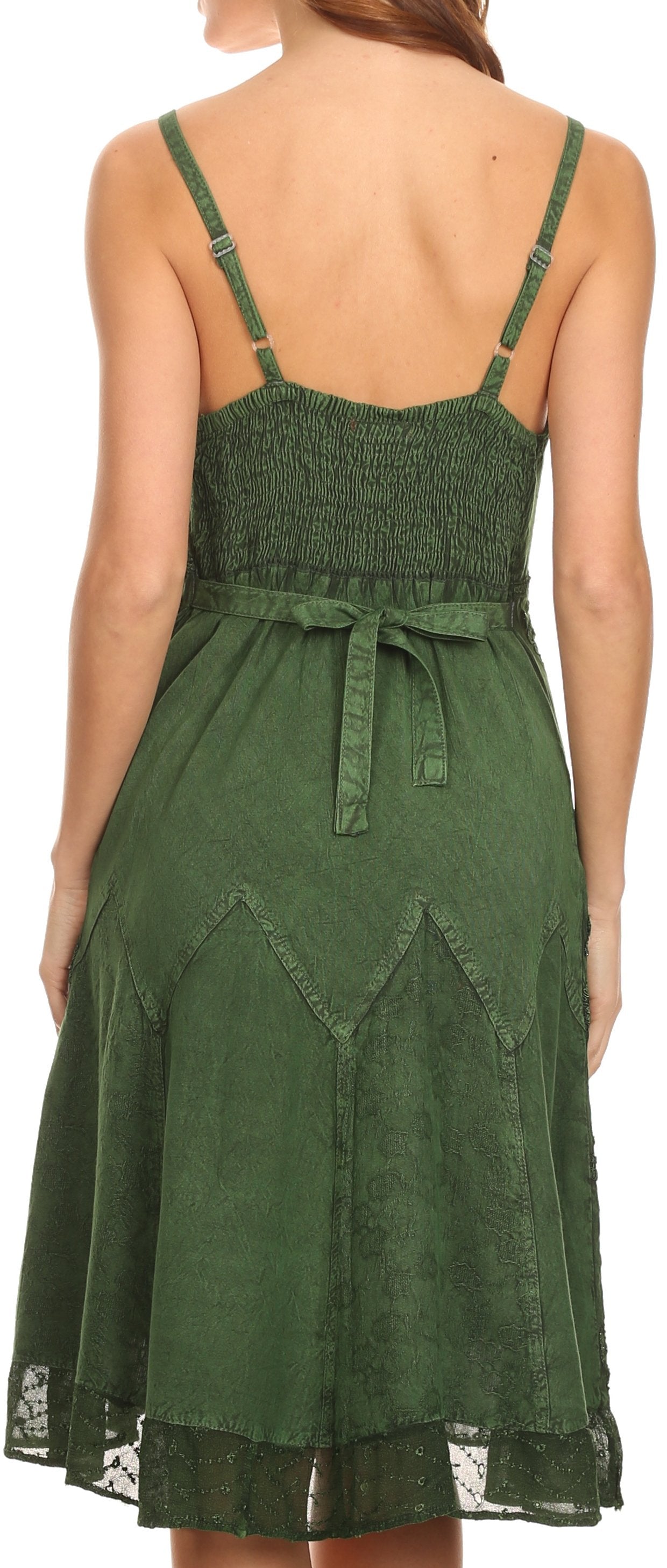 Green dress with thin straps and lace trim on a white background