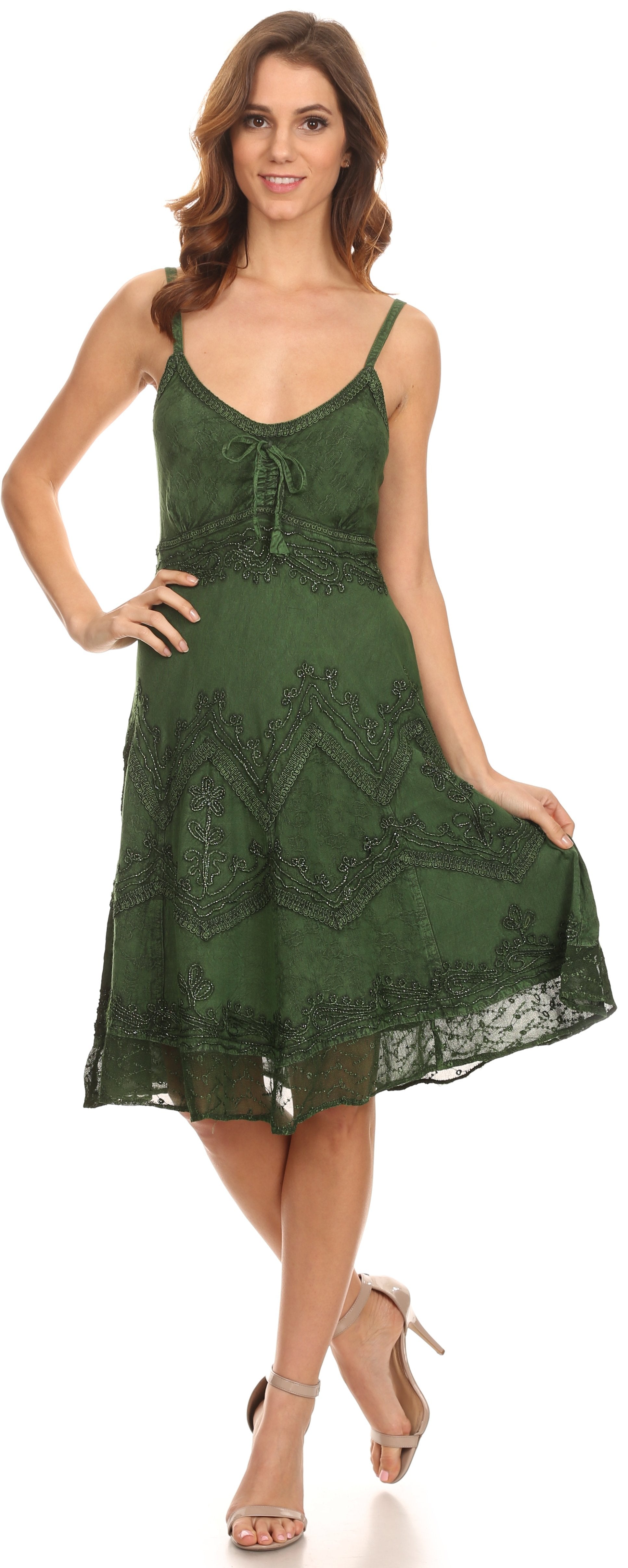 Woman wearing a green lace dress on a white background