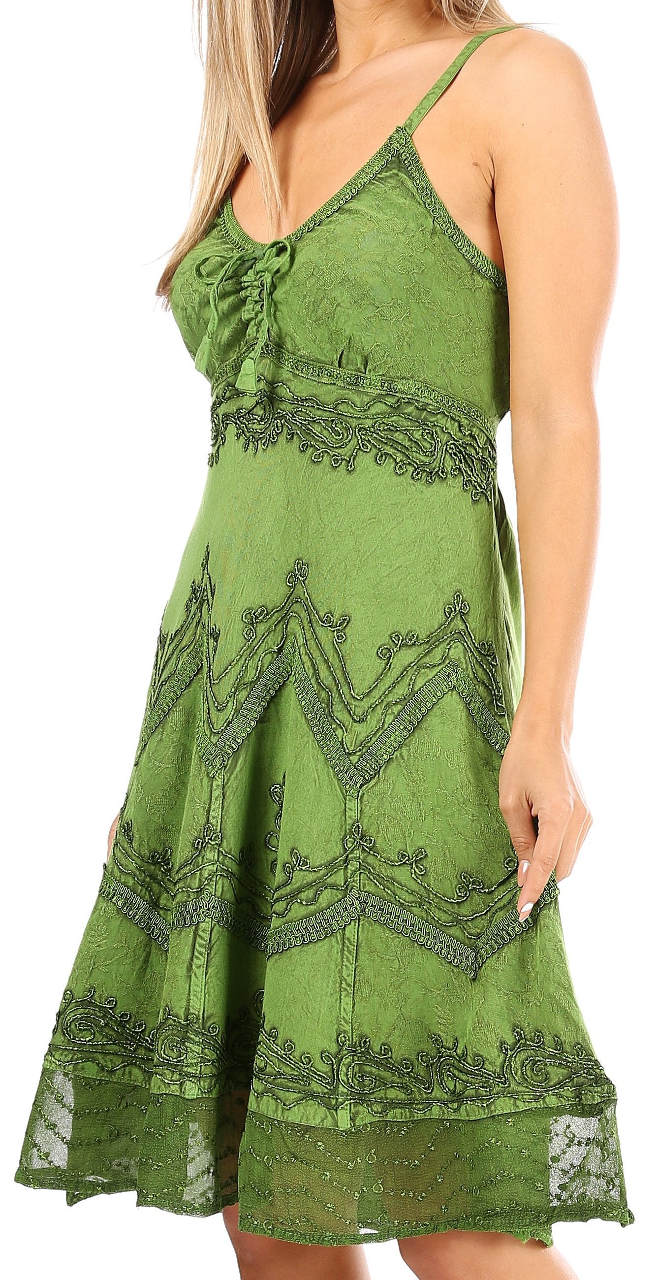 Green lace dress worn by a model on a white background