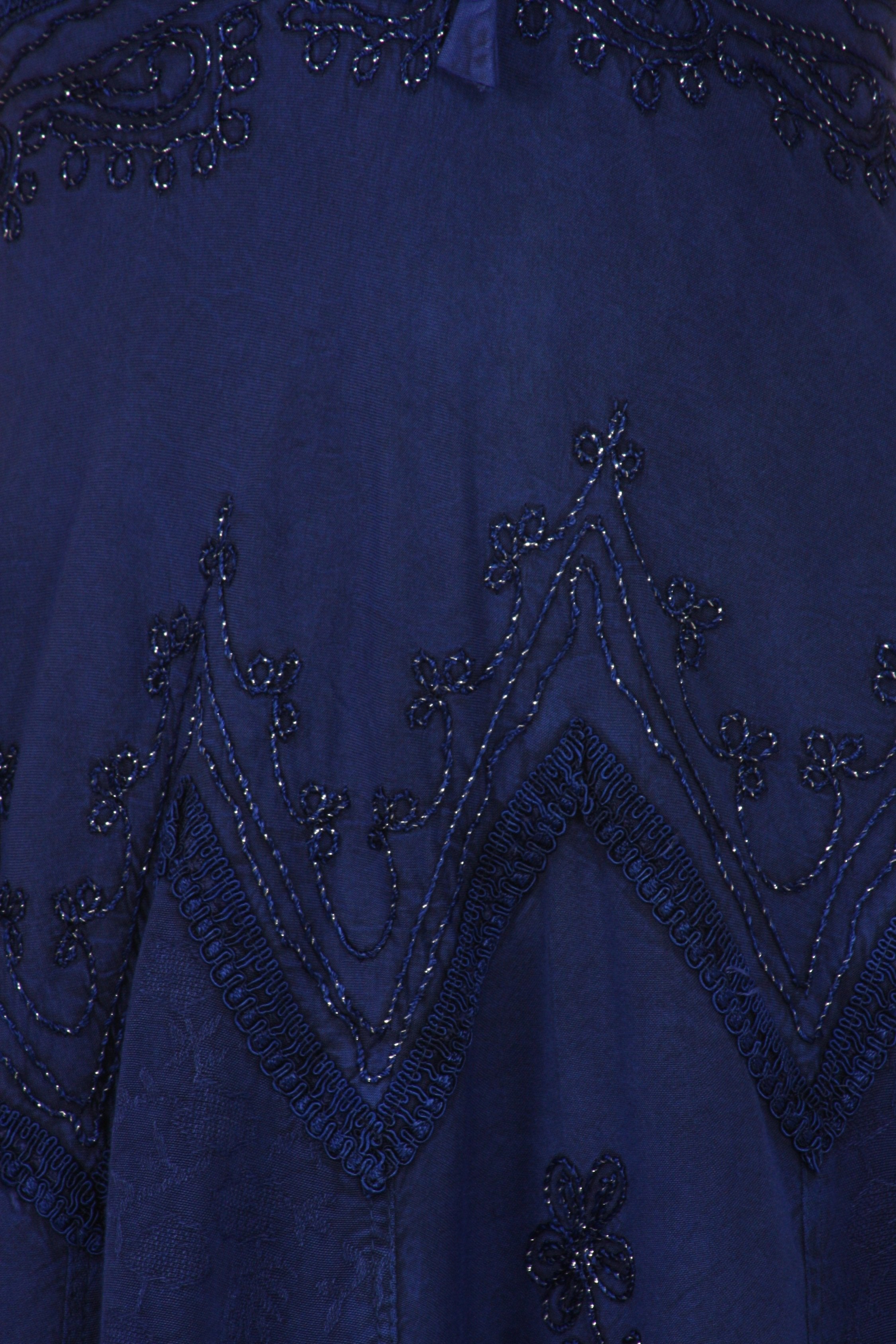 Close-up of a blue dress with intricate beadwork