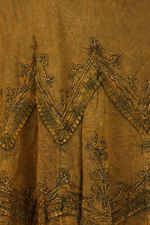 Close-up of ornate brown fabric with intricate patterns