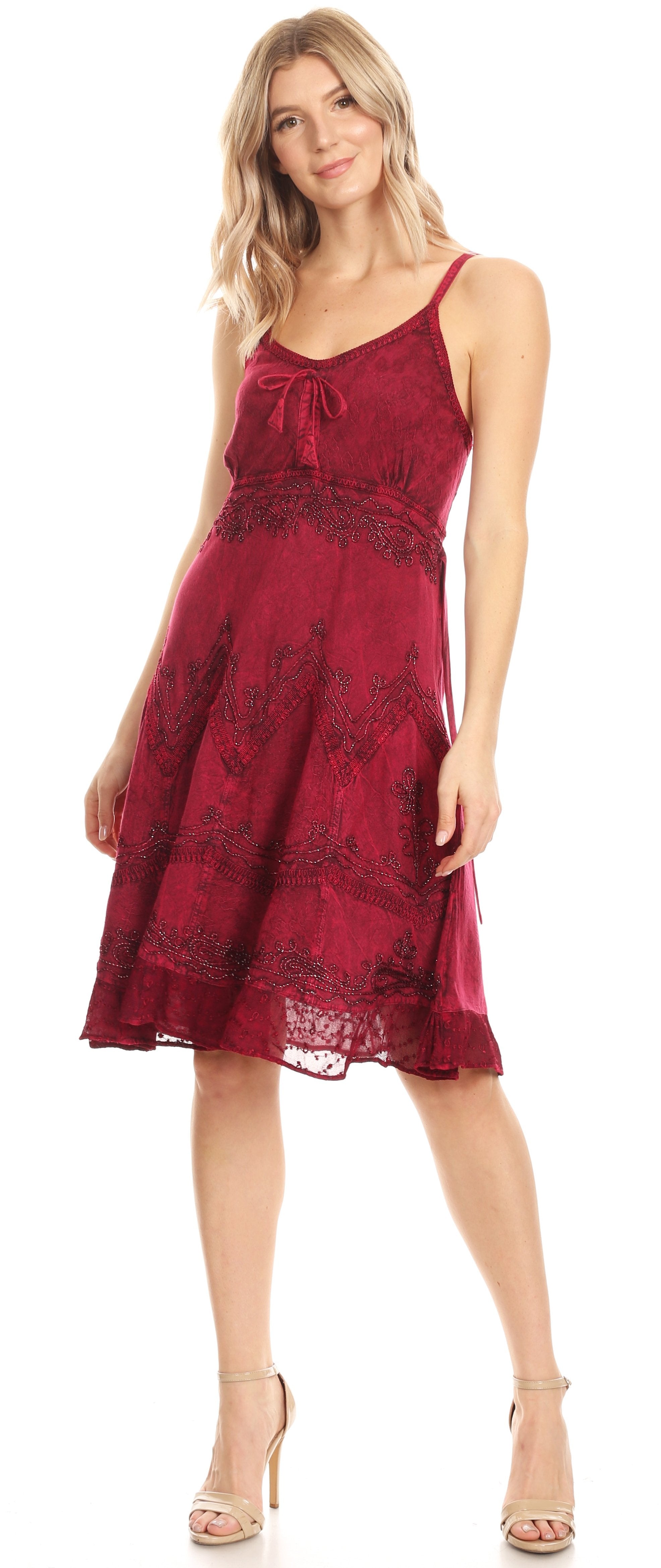 Woman wearing a red lace dress on a white background