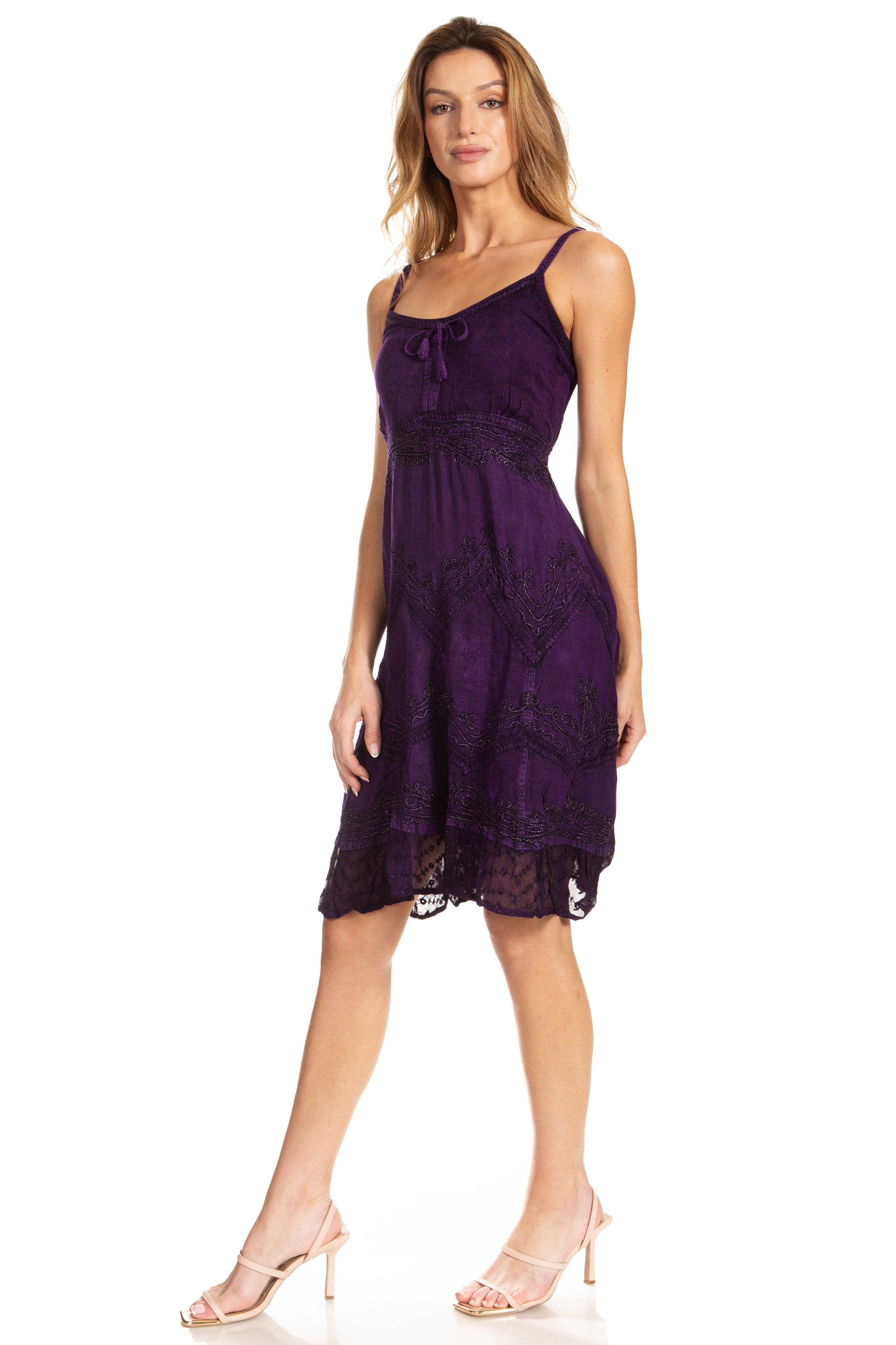 Woman wearing a purple lace dress on a white background
