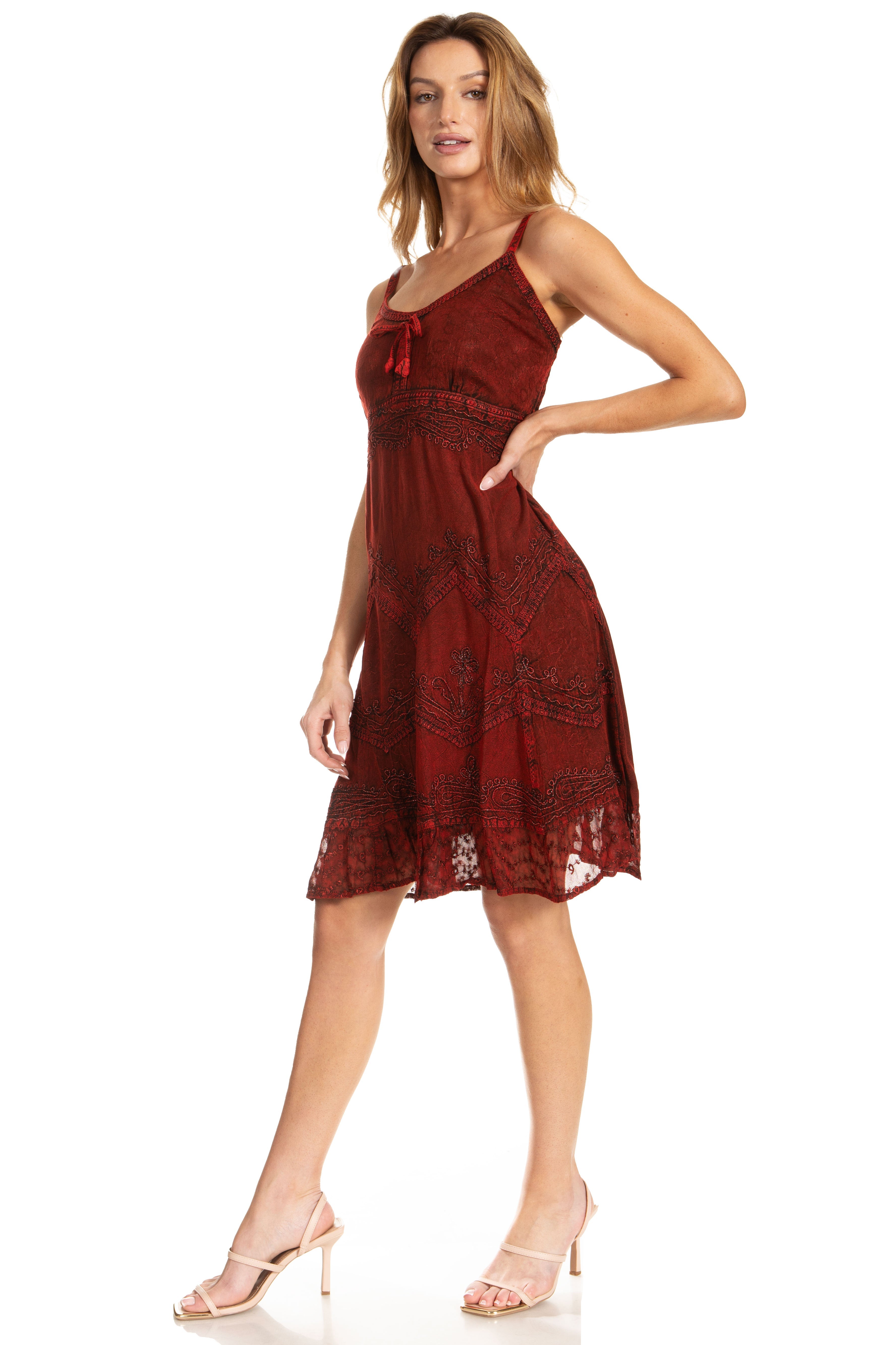 Woman wearing a red lace dress on a white background