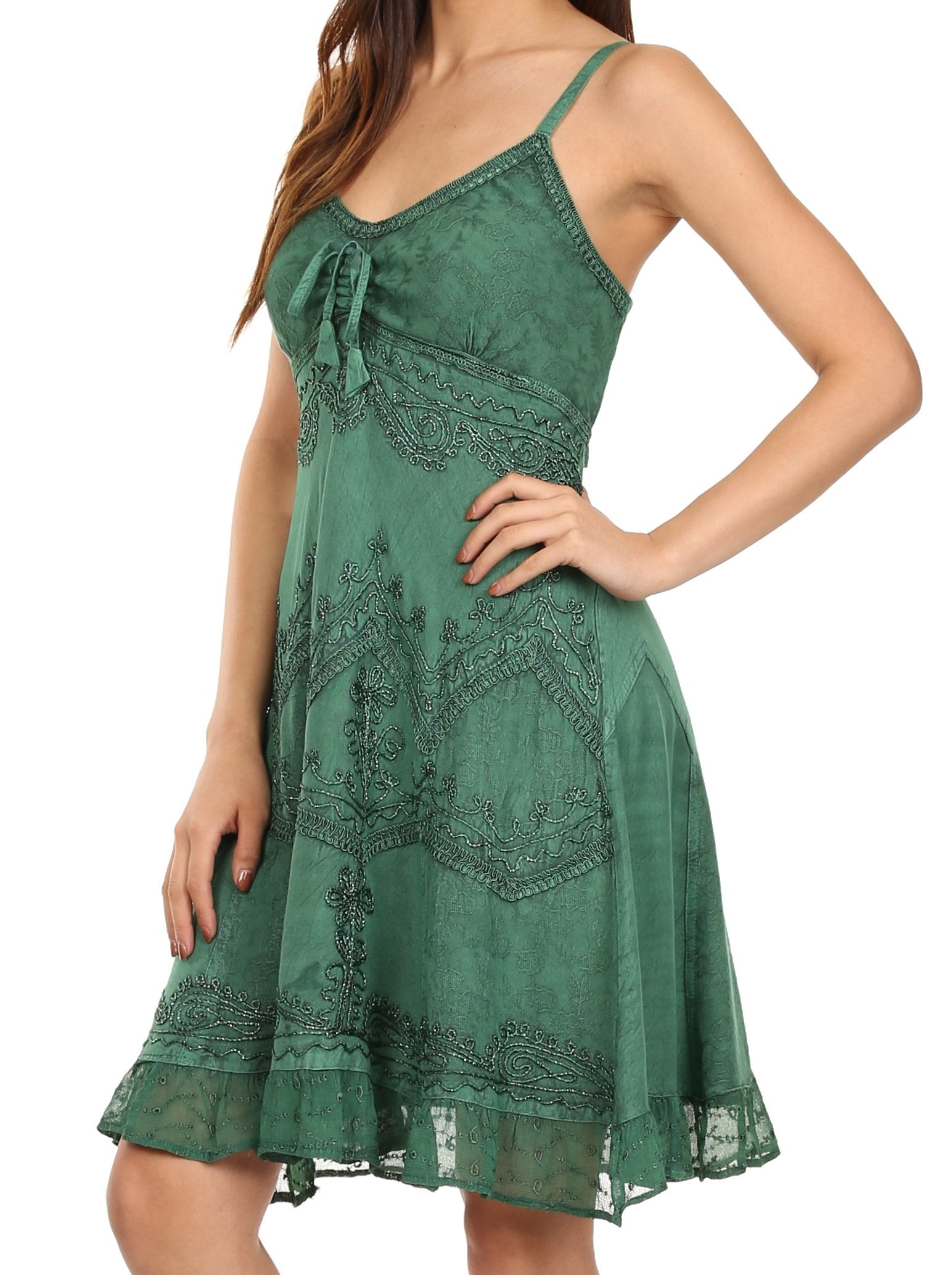 Green lace dress worn by a model on a white background