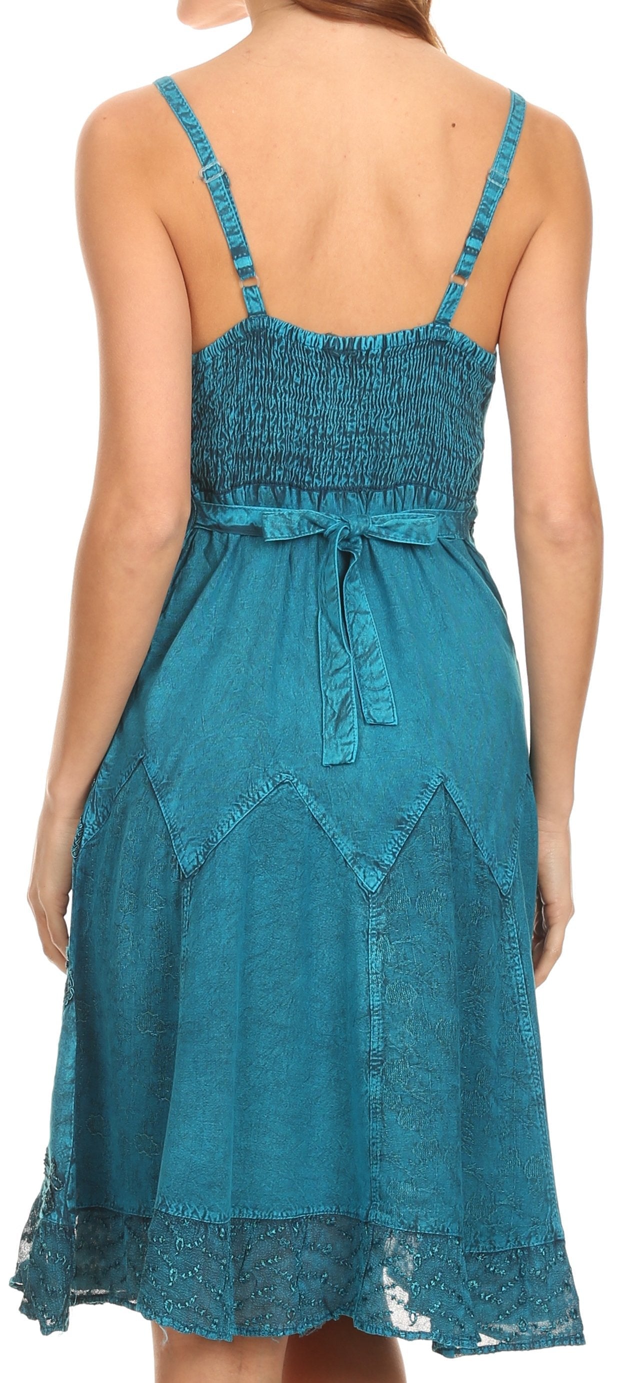 Teal dress with smocked bodice and lace details on a white background