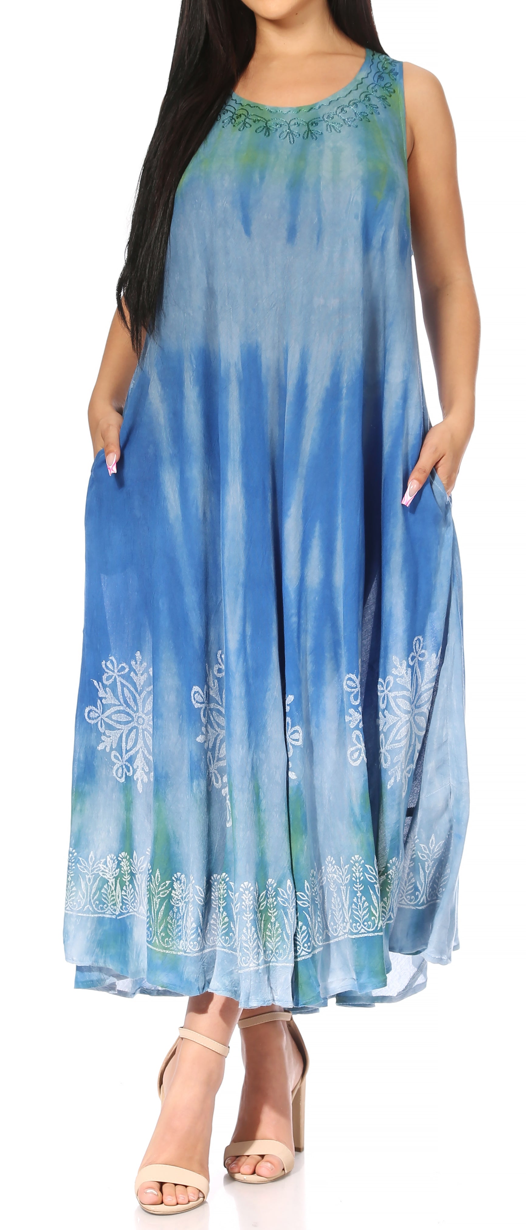 Woman wearing a blue tie-dye dress with white floral patterns on a white background