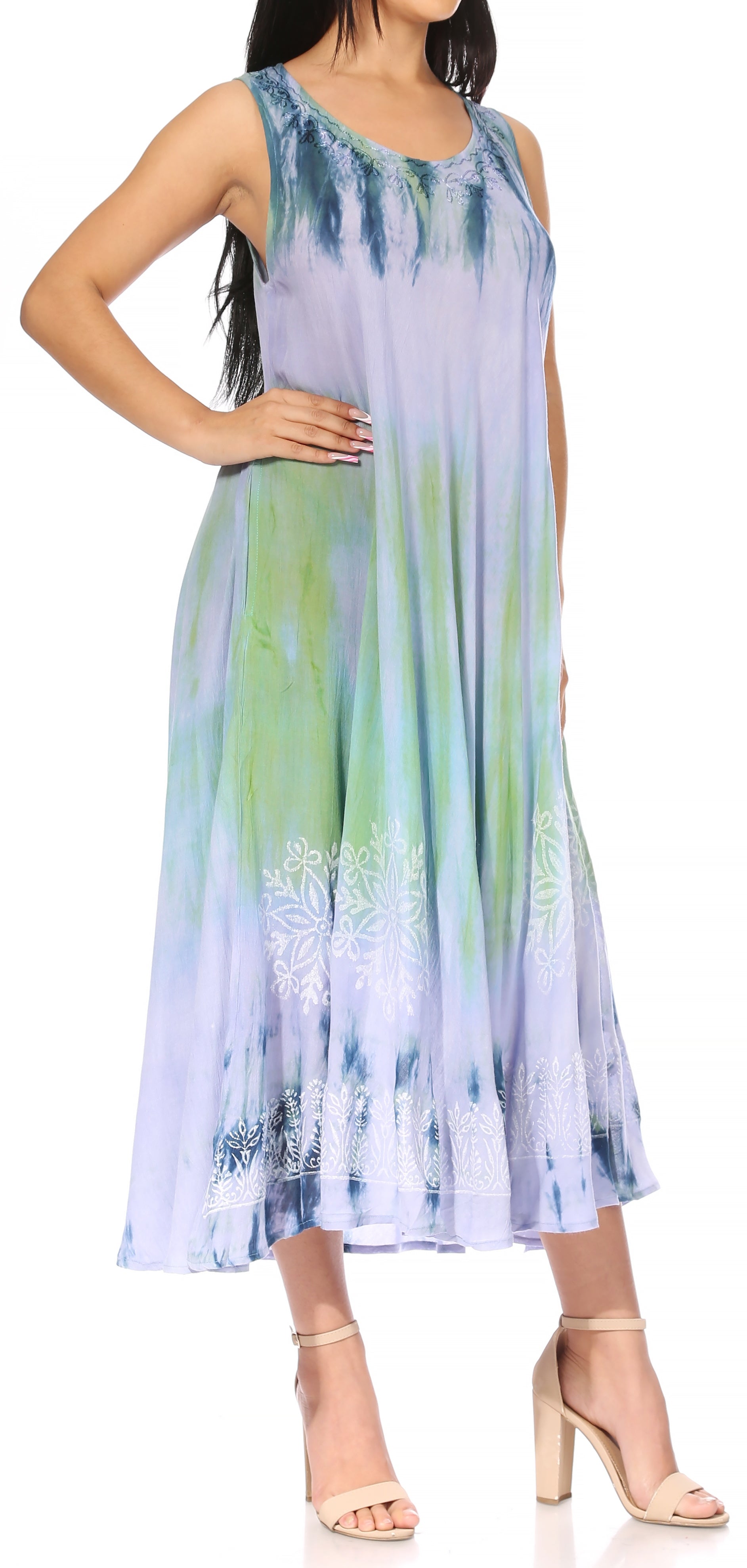 Woman wearing a sleeveless dress with a gradient design on a white background