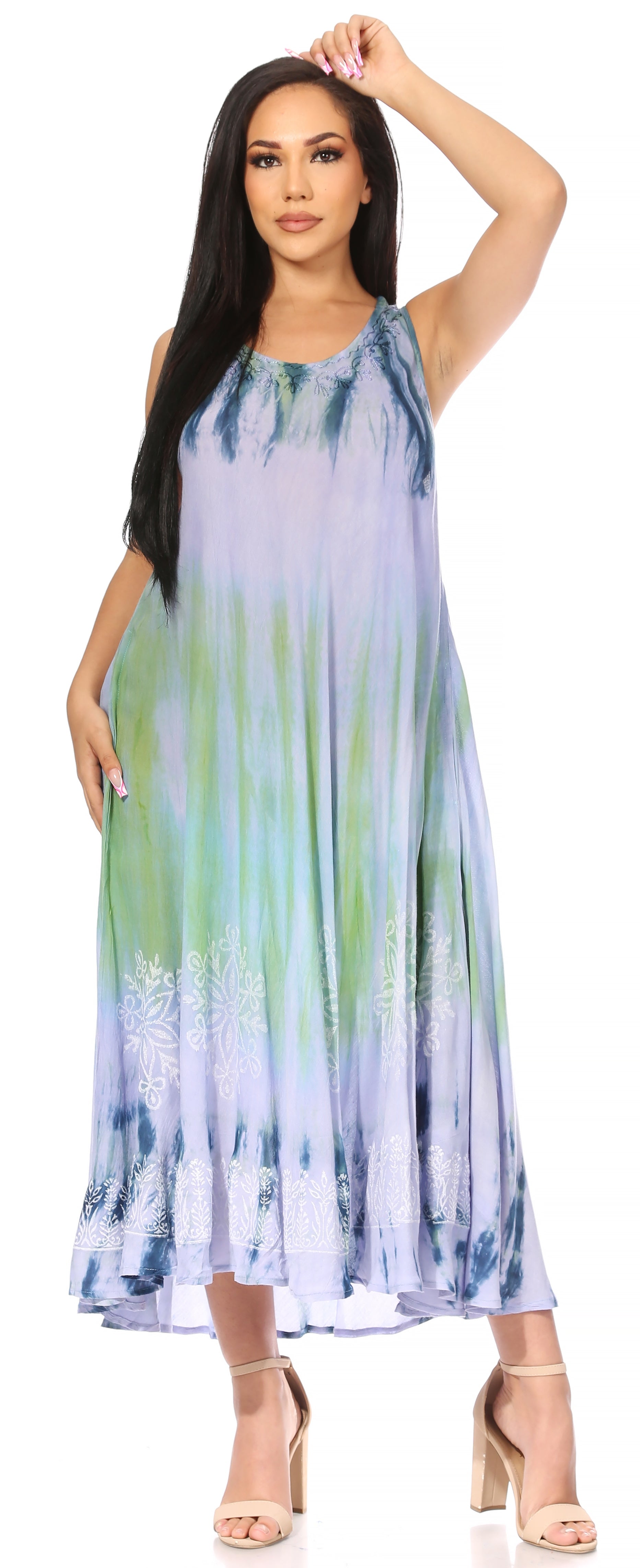 Woman wearing a tie-dye dress with a gradient of blue, green, and purple.
