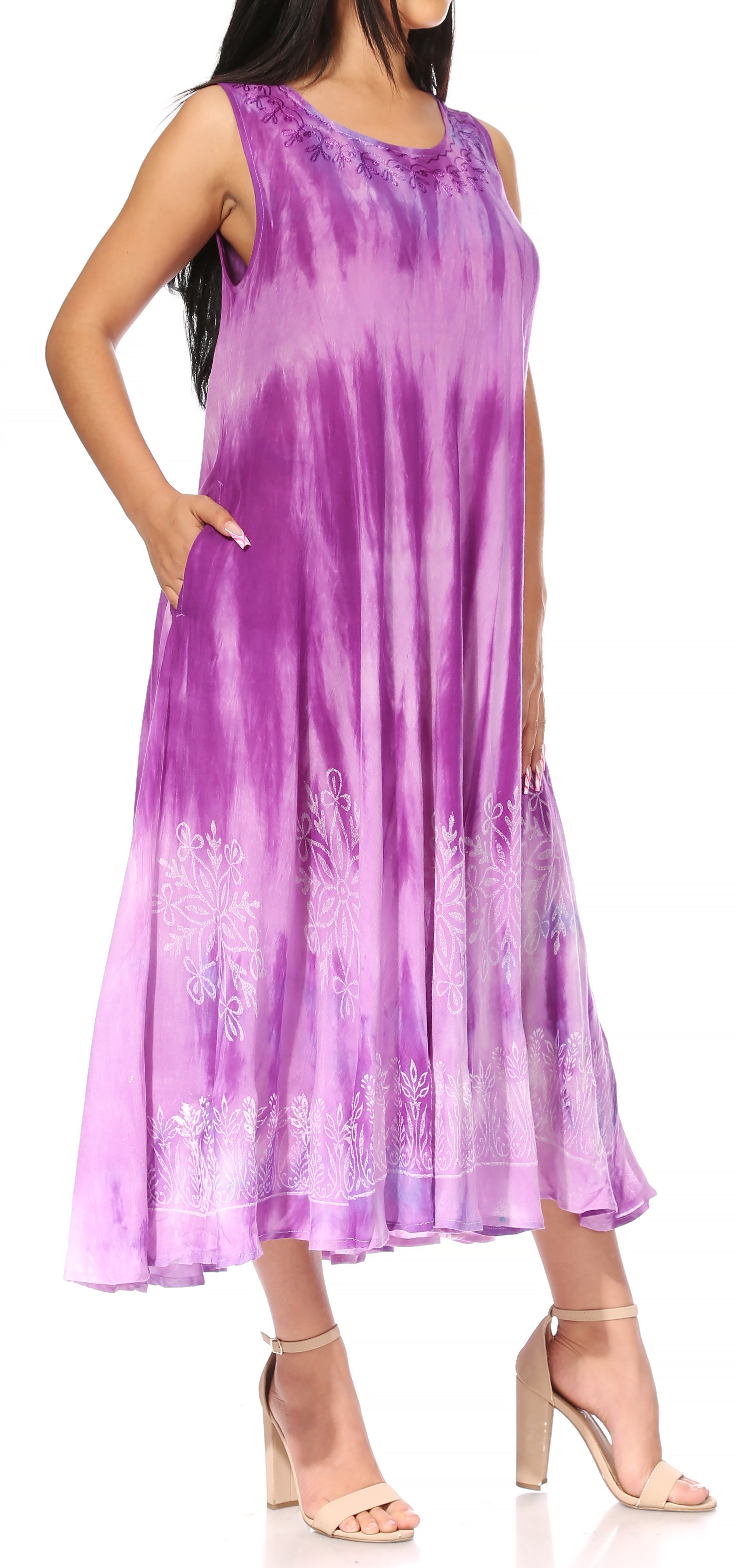 Woman wearing a sleeveless purple tie-dye dress on a white background