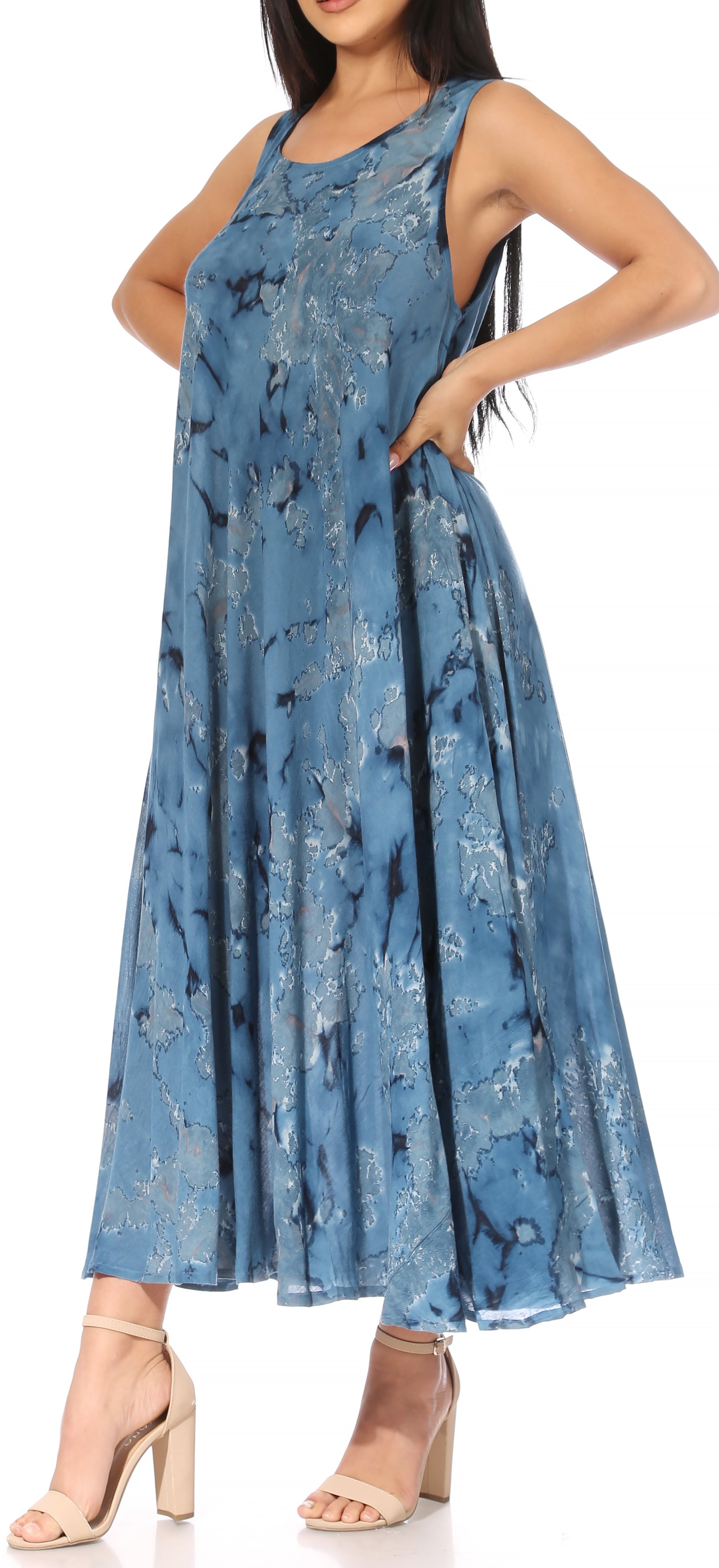 Woman wearing a blue floral dress on a white background