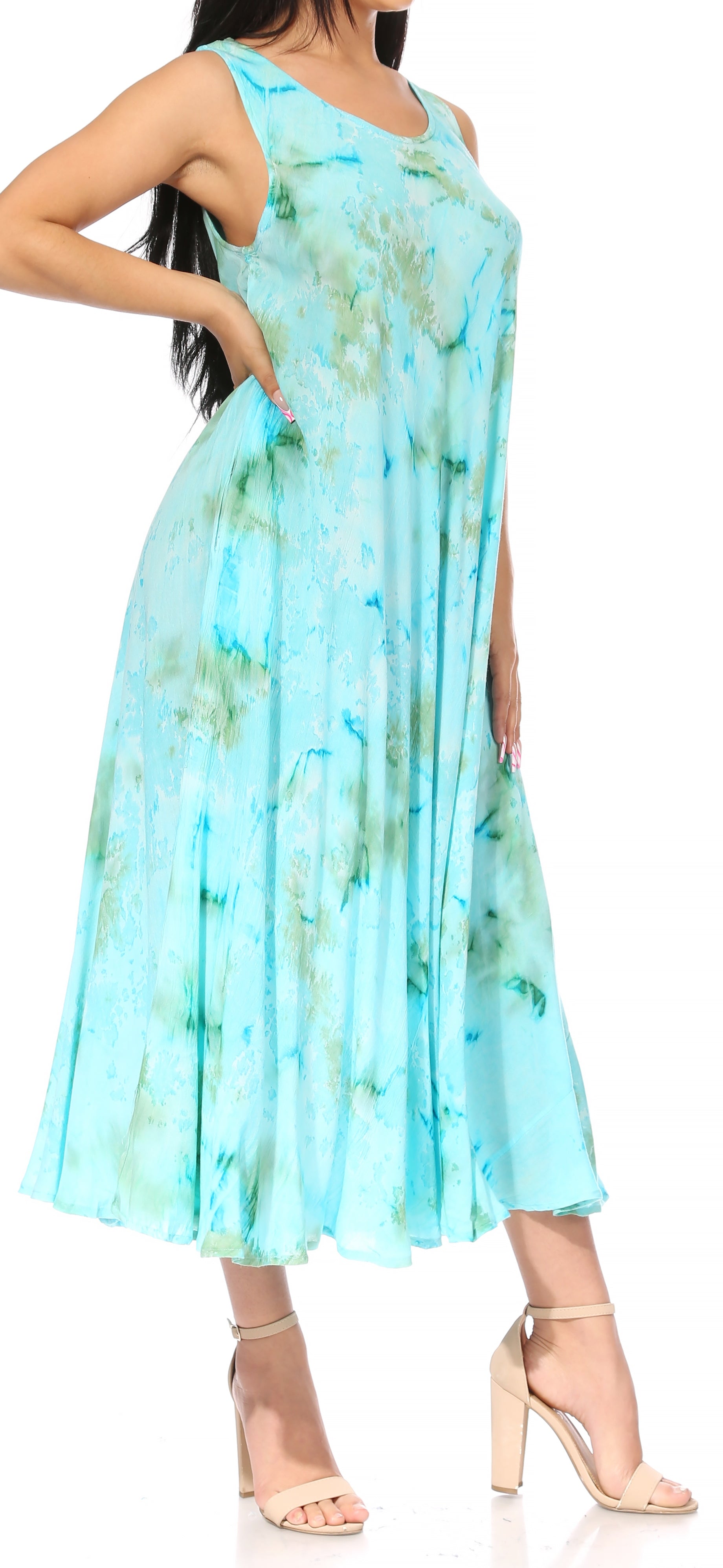 Woman wearing a light blue tie-dye dress with a blurred background