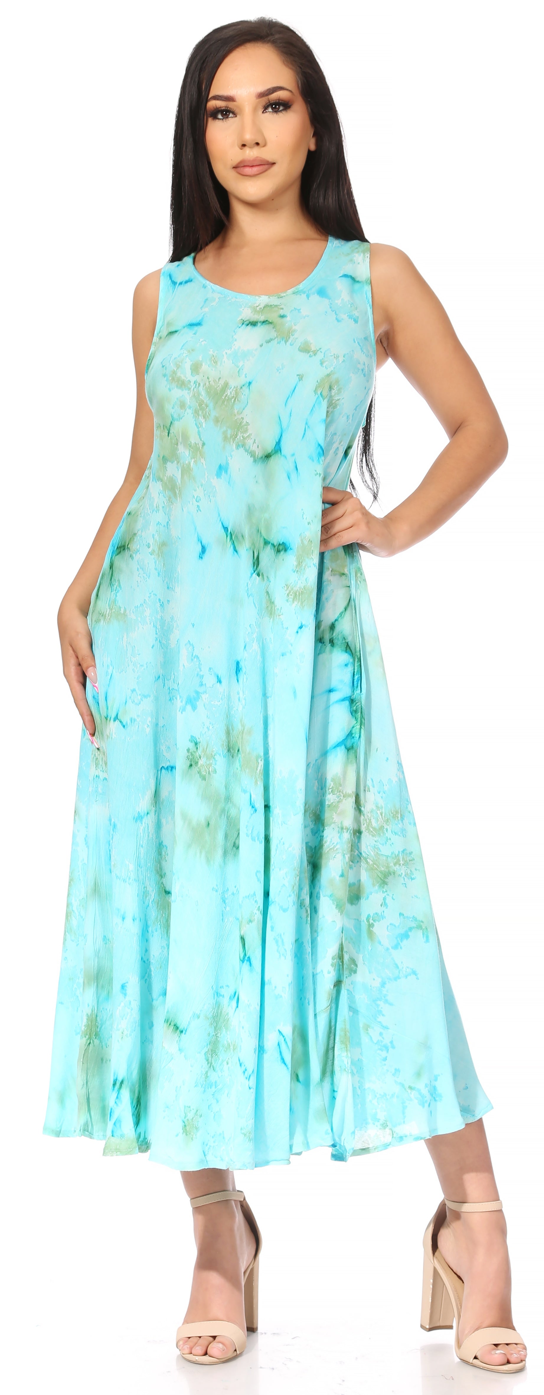 Woman wearing a sleeveless, light blue tie-dye dress on a white background