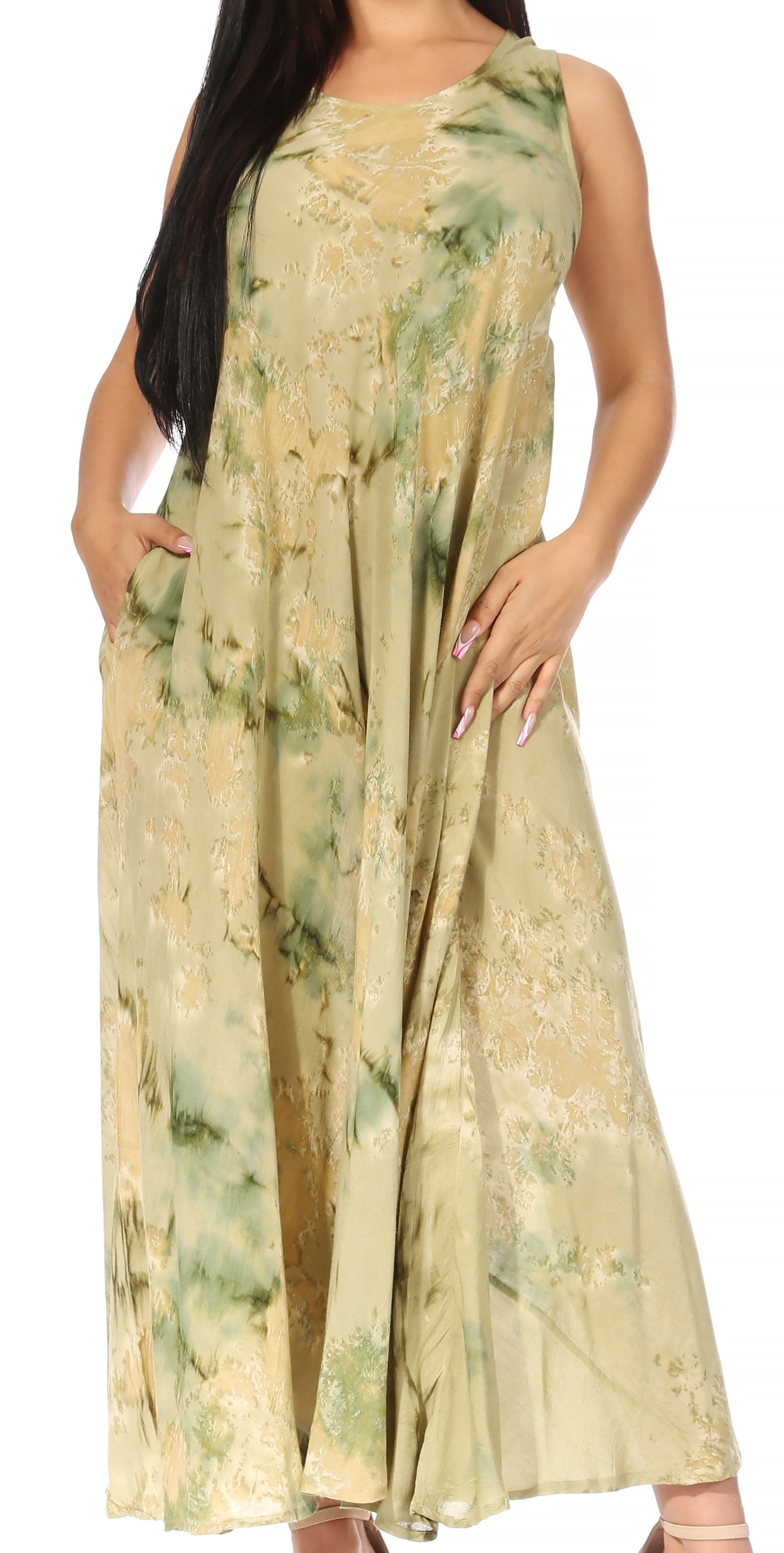 Woman wearing a long, light-colored dress with floral patterns on a white background