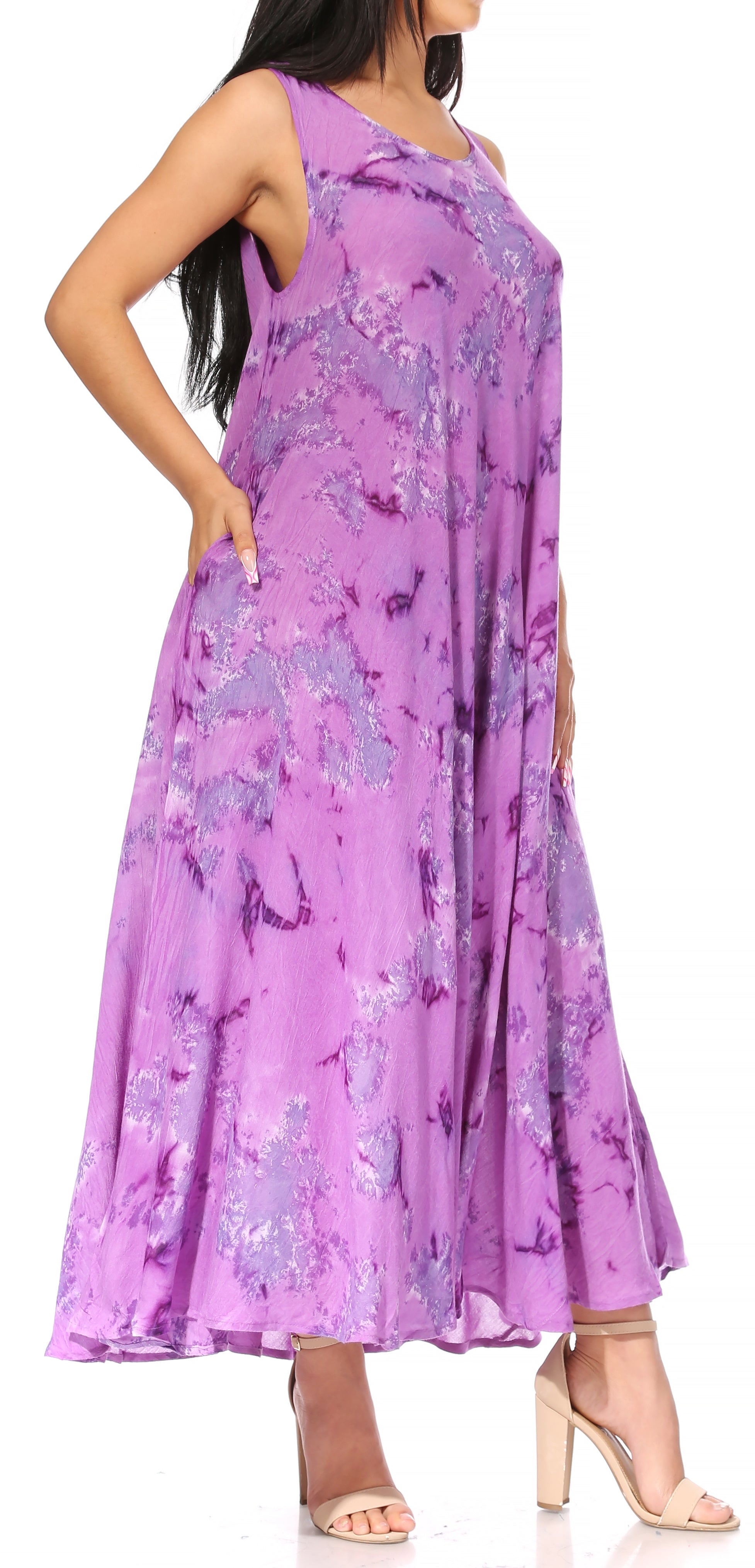 Woman wearing a purple floral dress on a white background