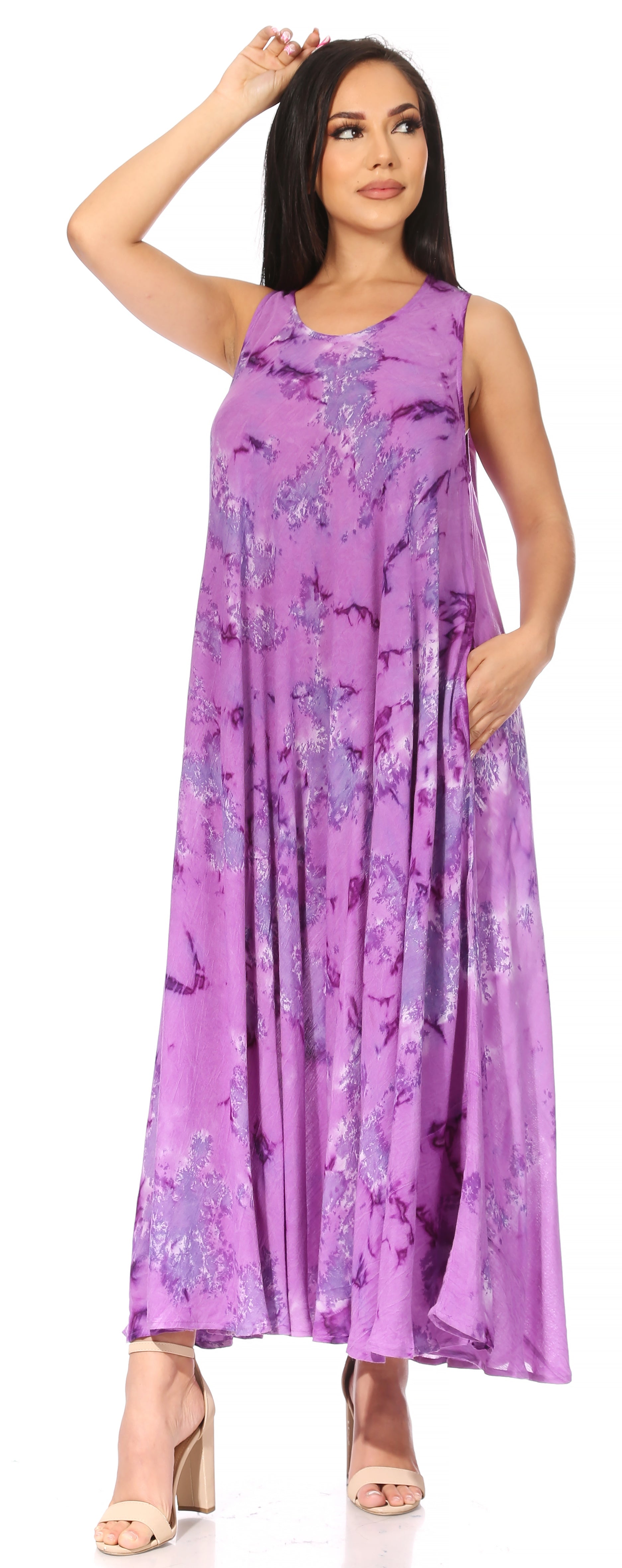 Woman wearing a purple floral dress on a white background