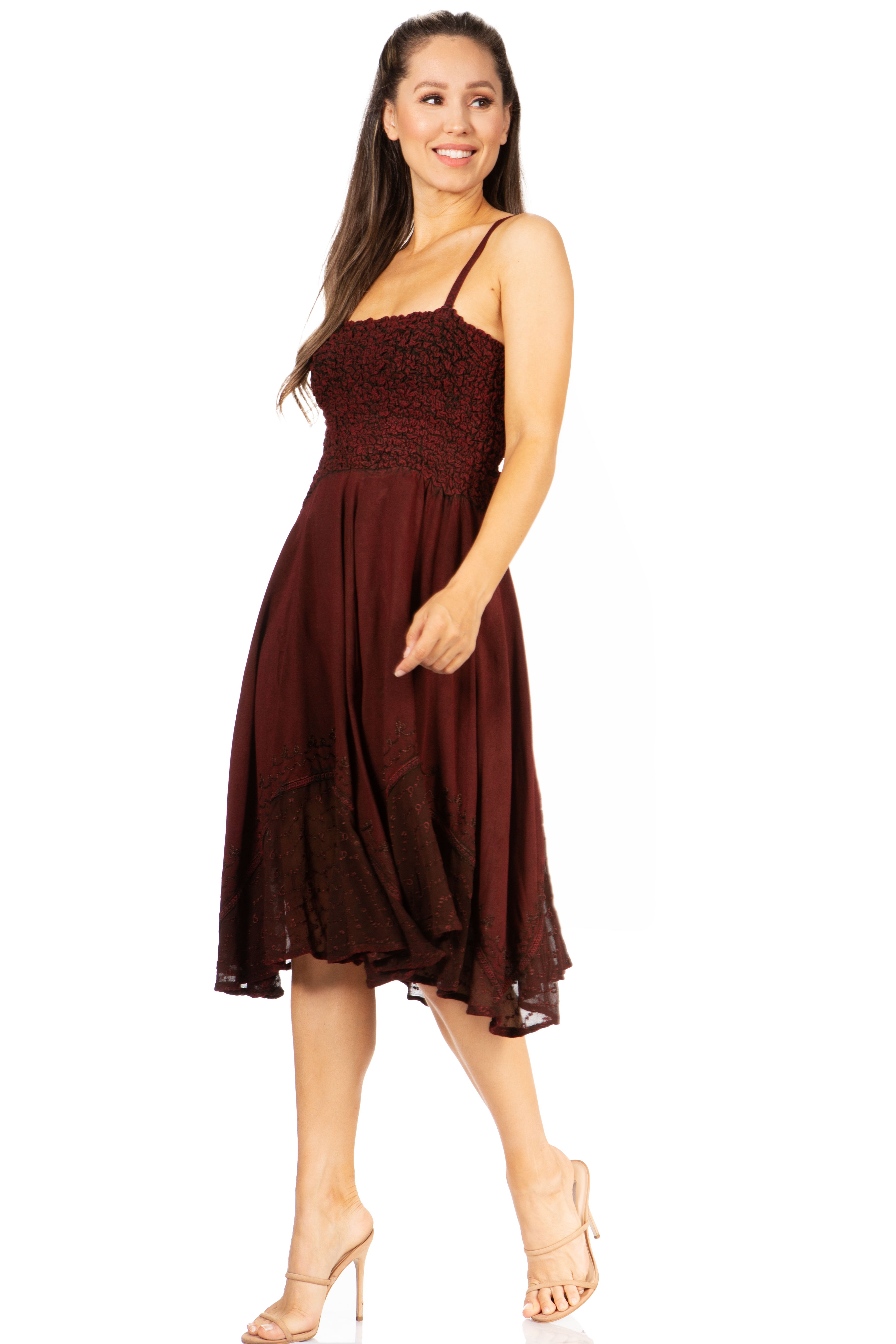 Woman wearing a burgundy dress with a white background
