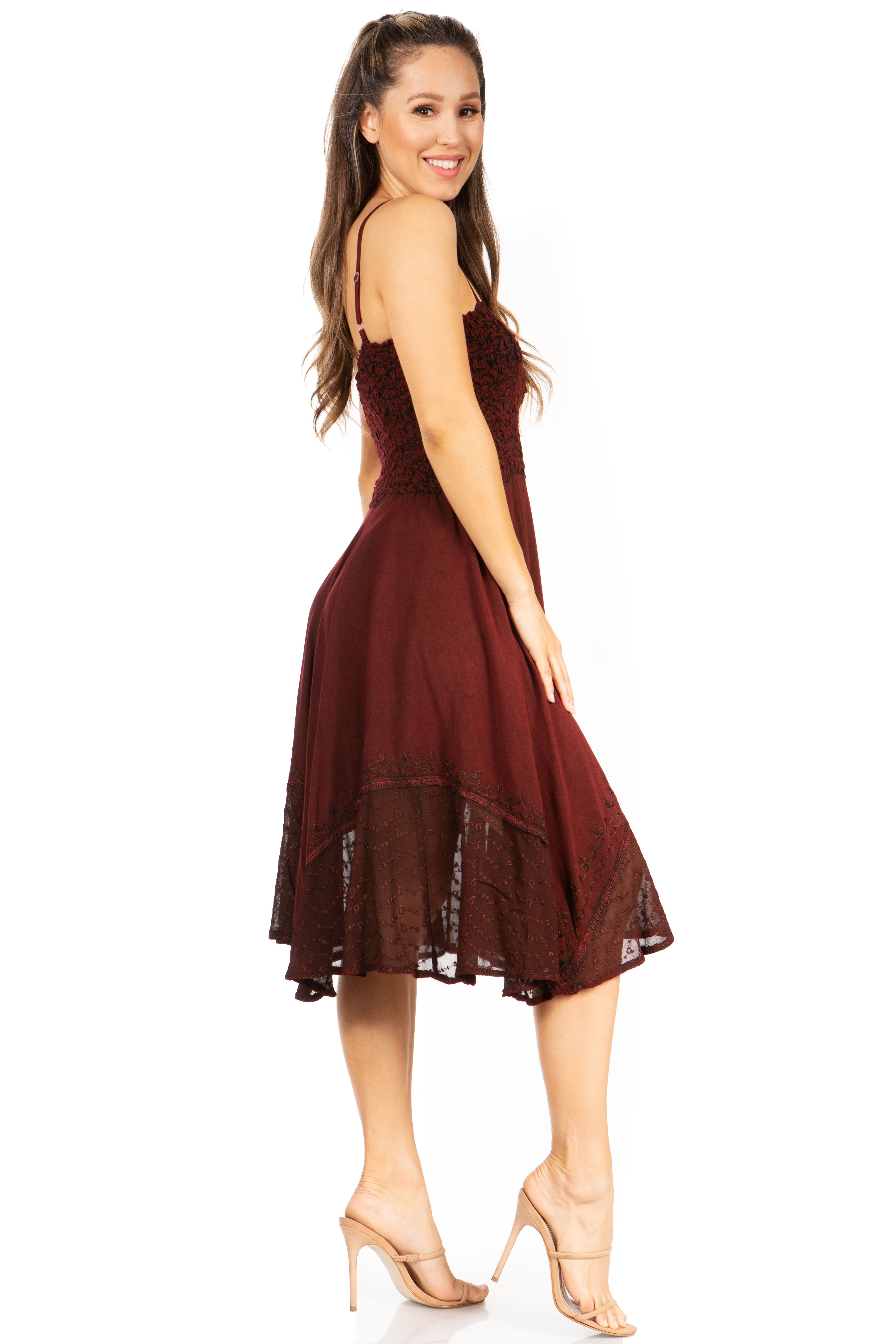 Woman wearing a burgundy dress on a white background