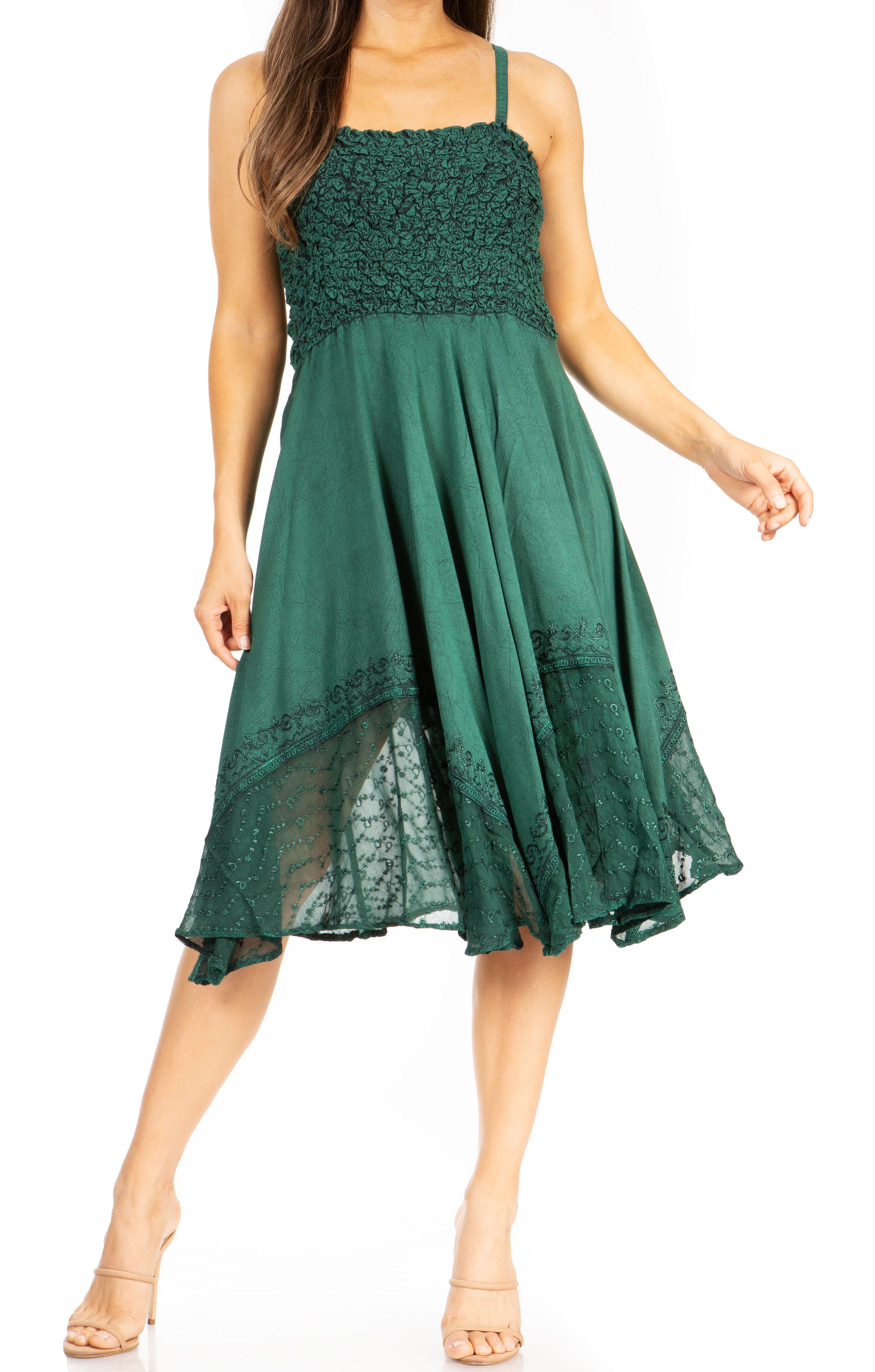 Green lace dress worn by a model on a white background