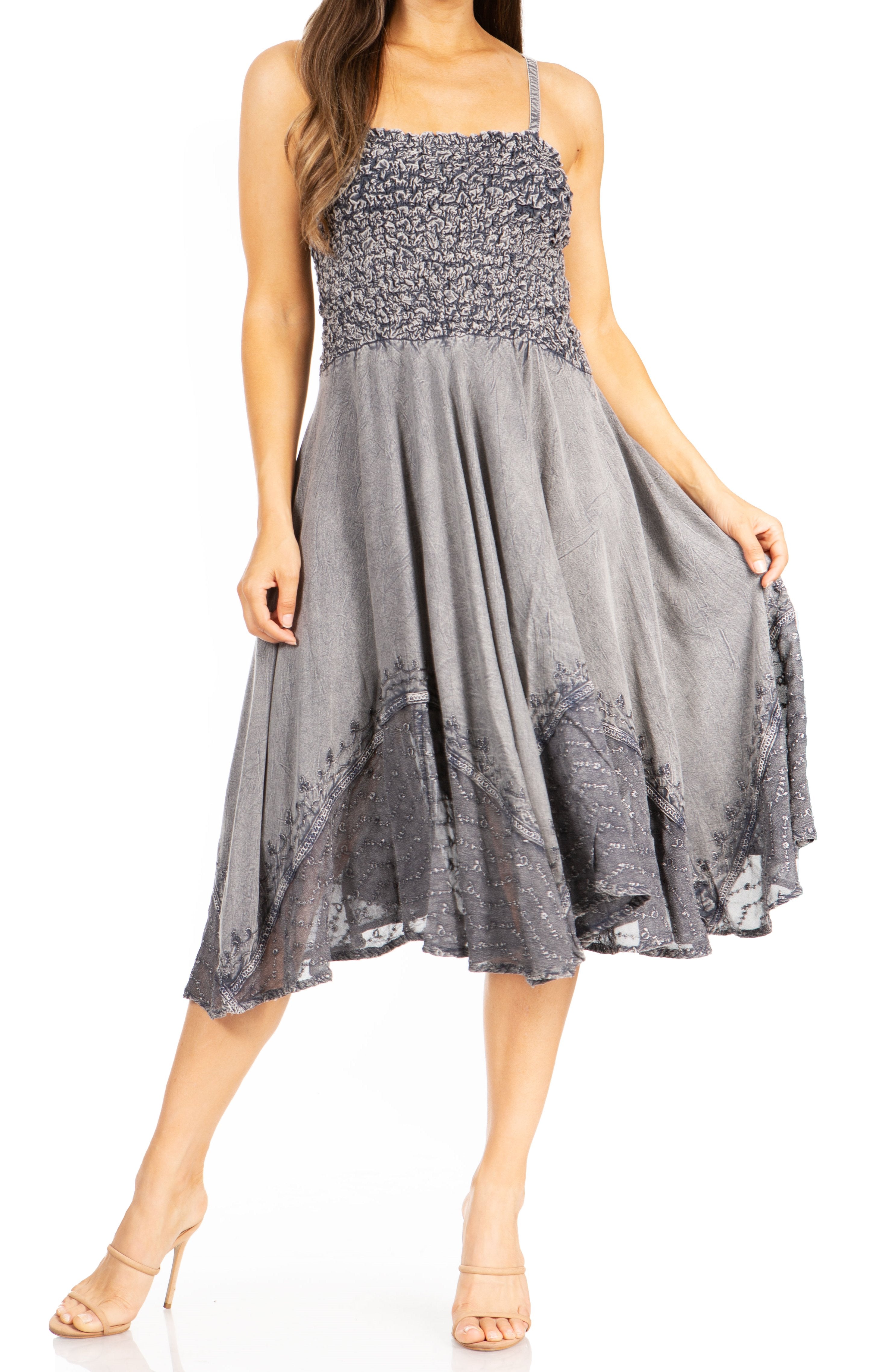 Woman wearing a gray lace dress on a white background