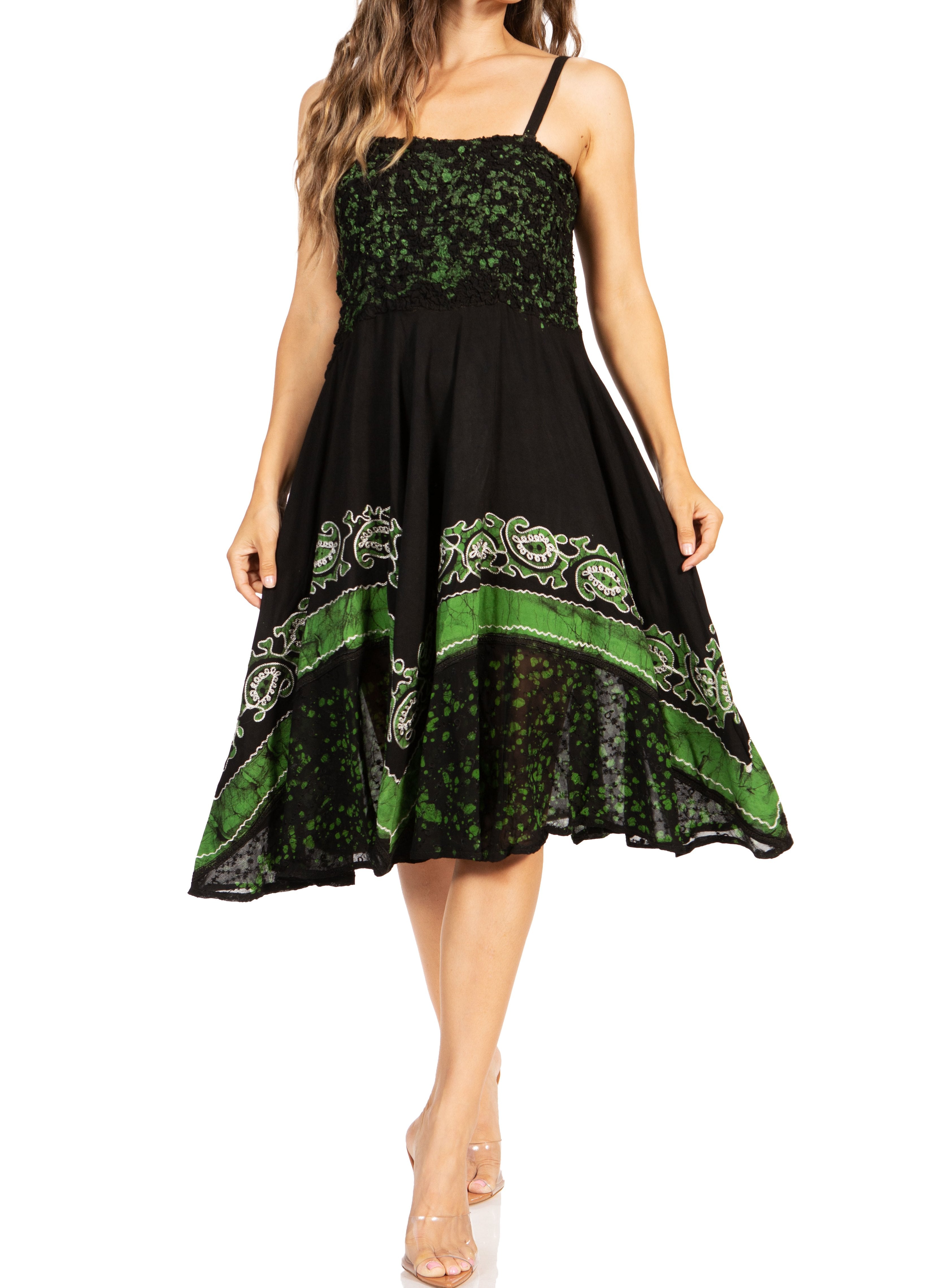 Black dress with green pattern on a white background