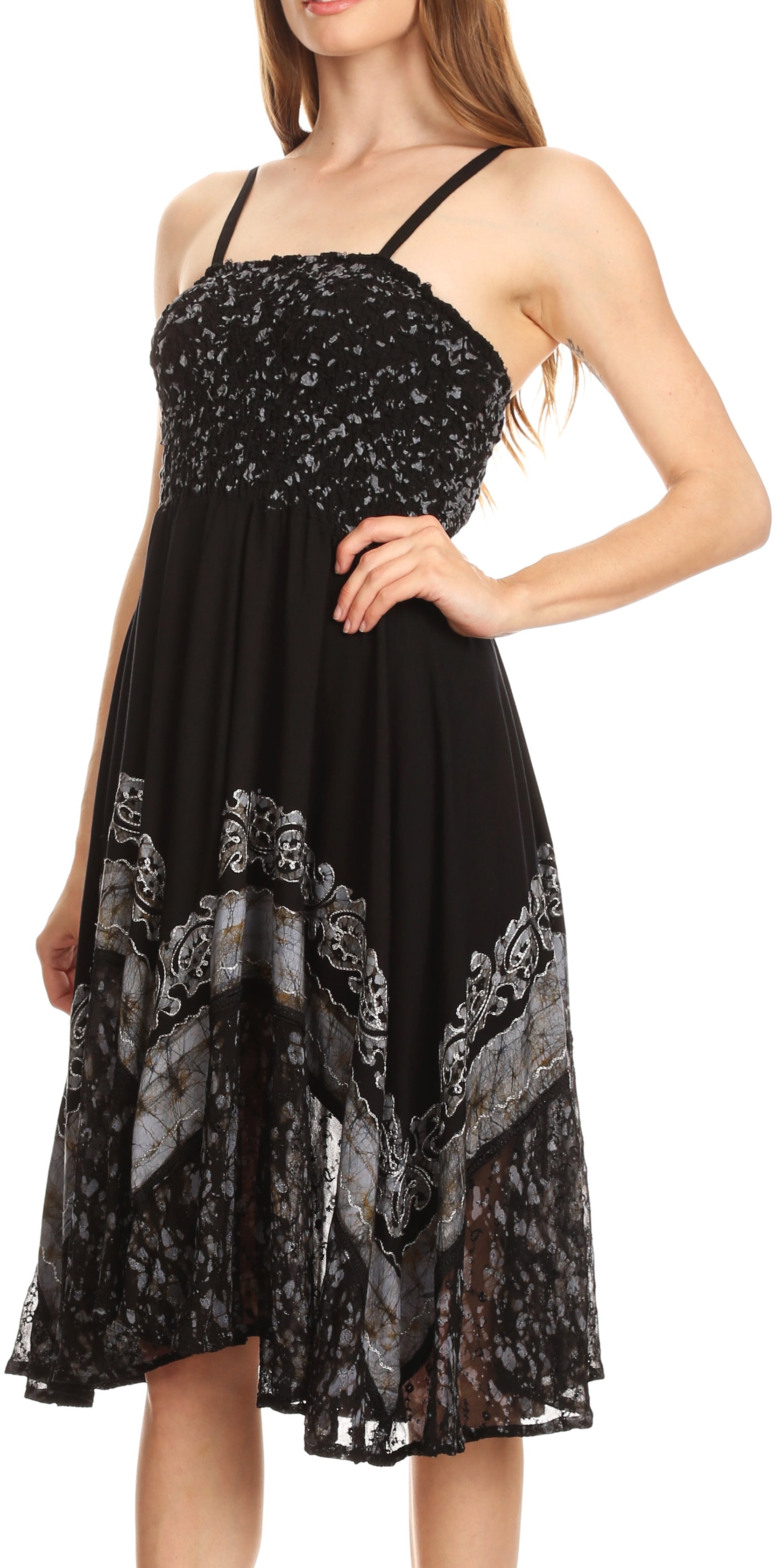 Black dress with floral lace details on a white background