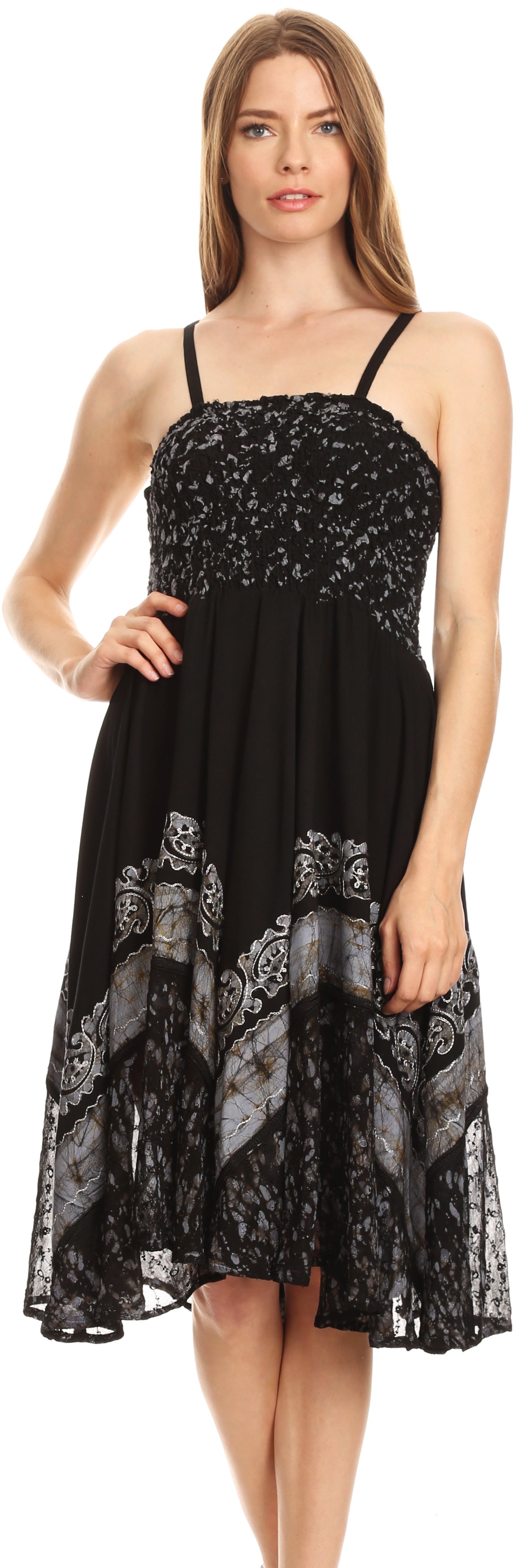 Woman wearing a black dress with lace details on a white background