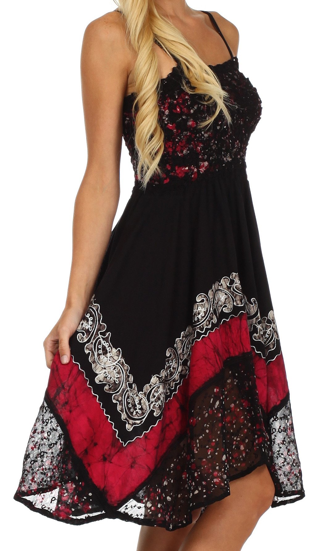 Black dress with red and white patterns worn by a model on a white background