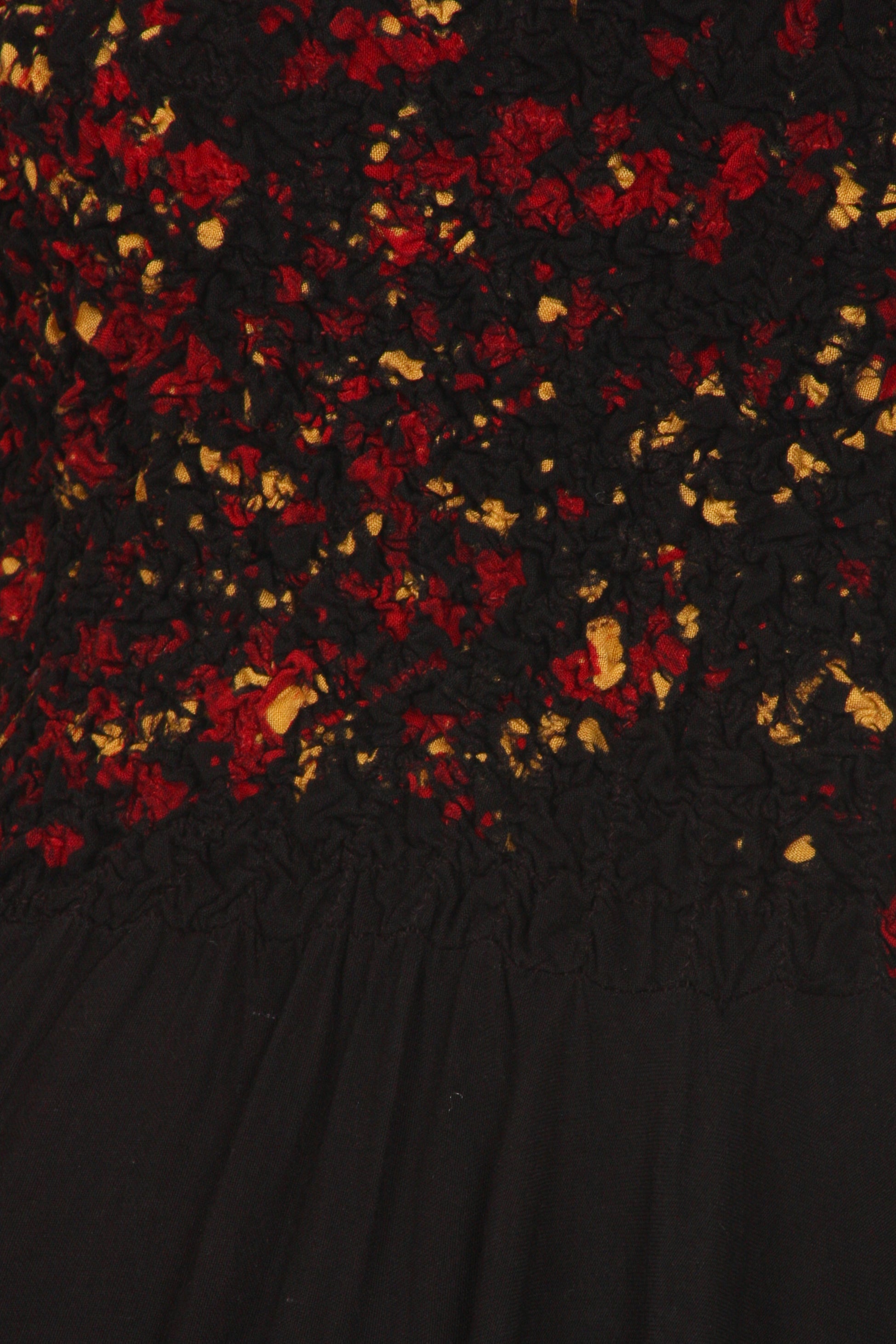 Black fabric with red and gold floral pattern