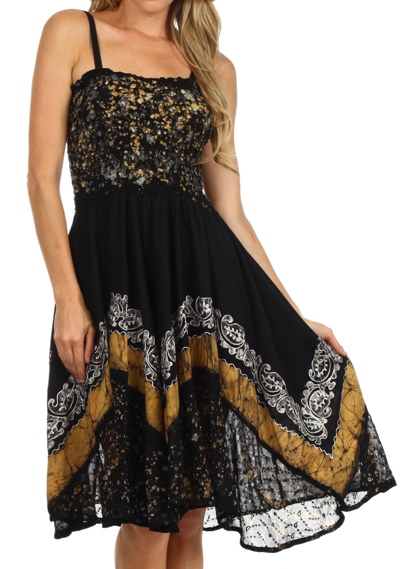 Black and gold dress with lace details on a white background