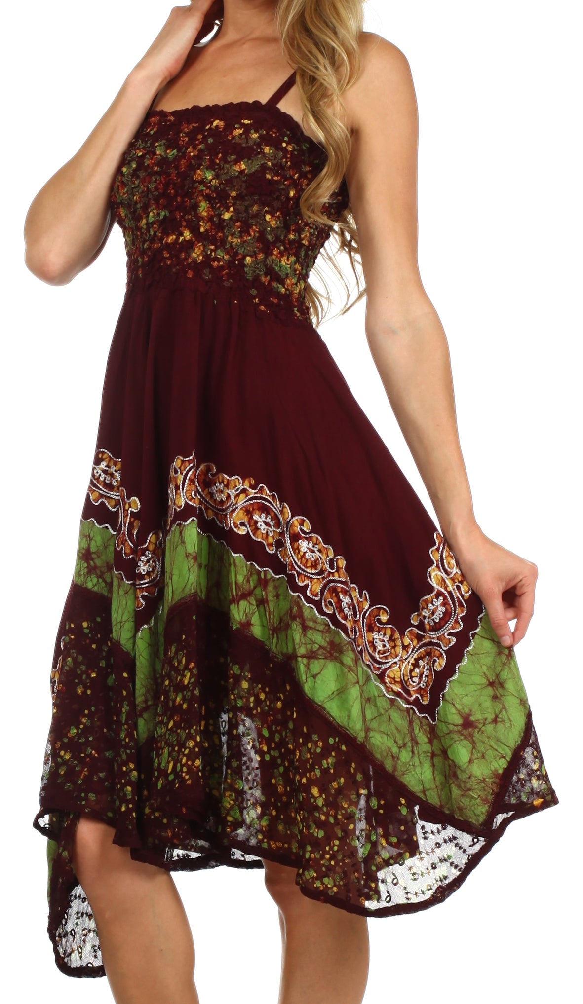 Woman wearing a patterned dress with a mix of colors on a white background
