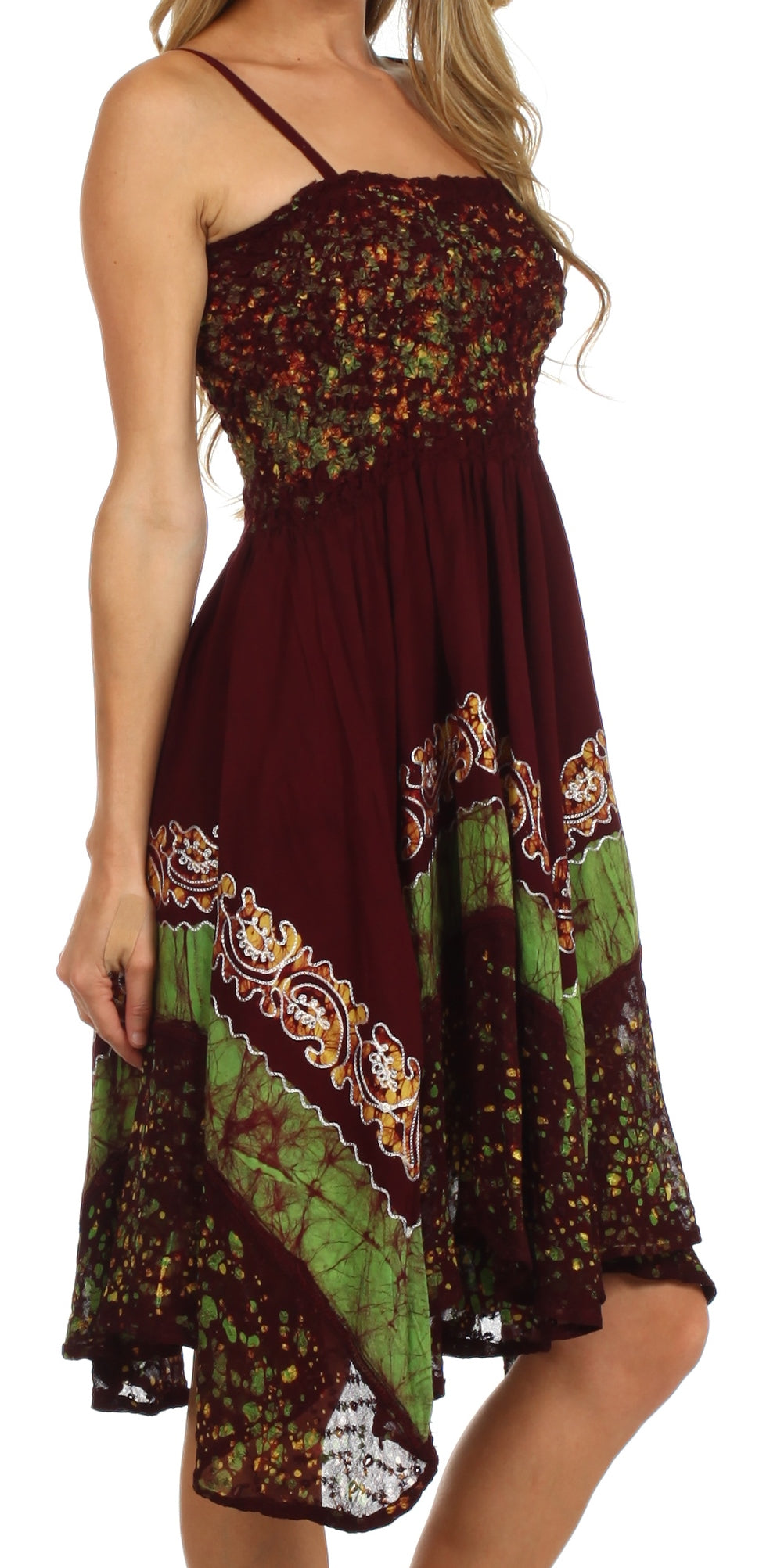 Woman wearing a patterned dress with a mix of colors on a white background