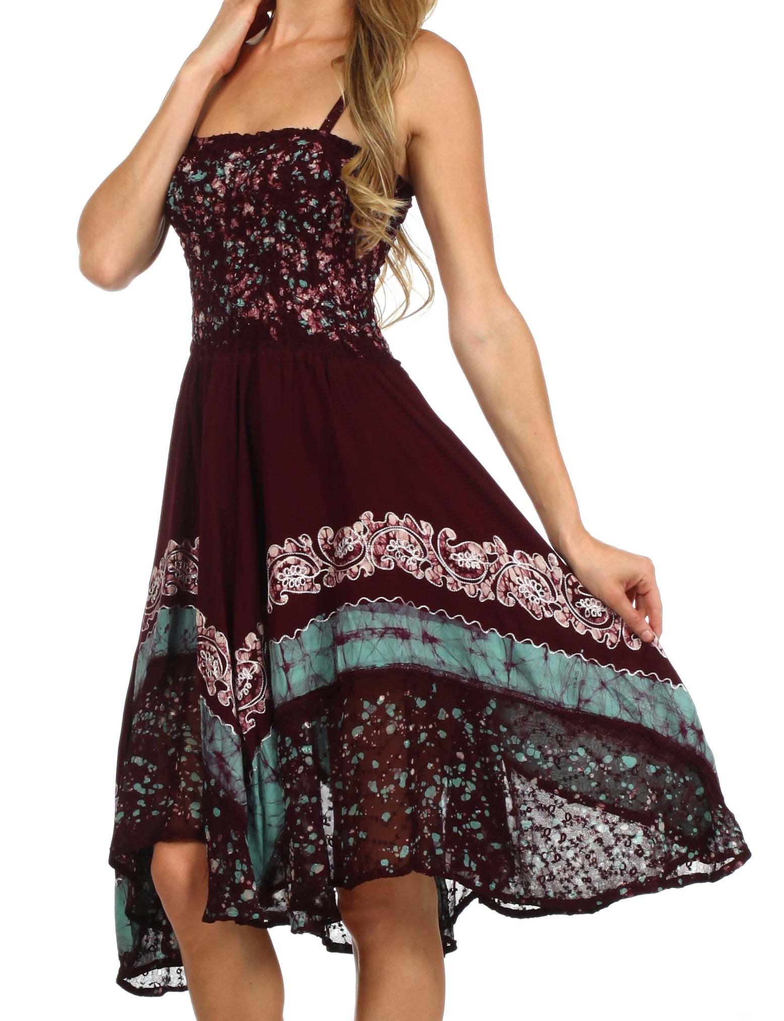 Multicolored dress with floral and lace patterns on a white background