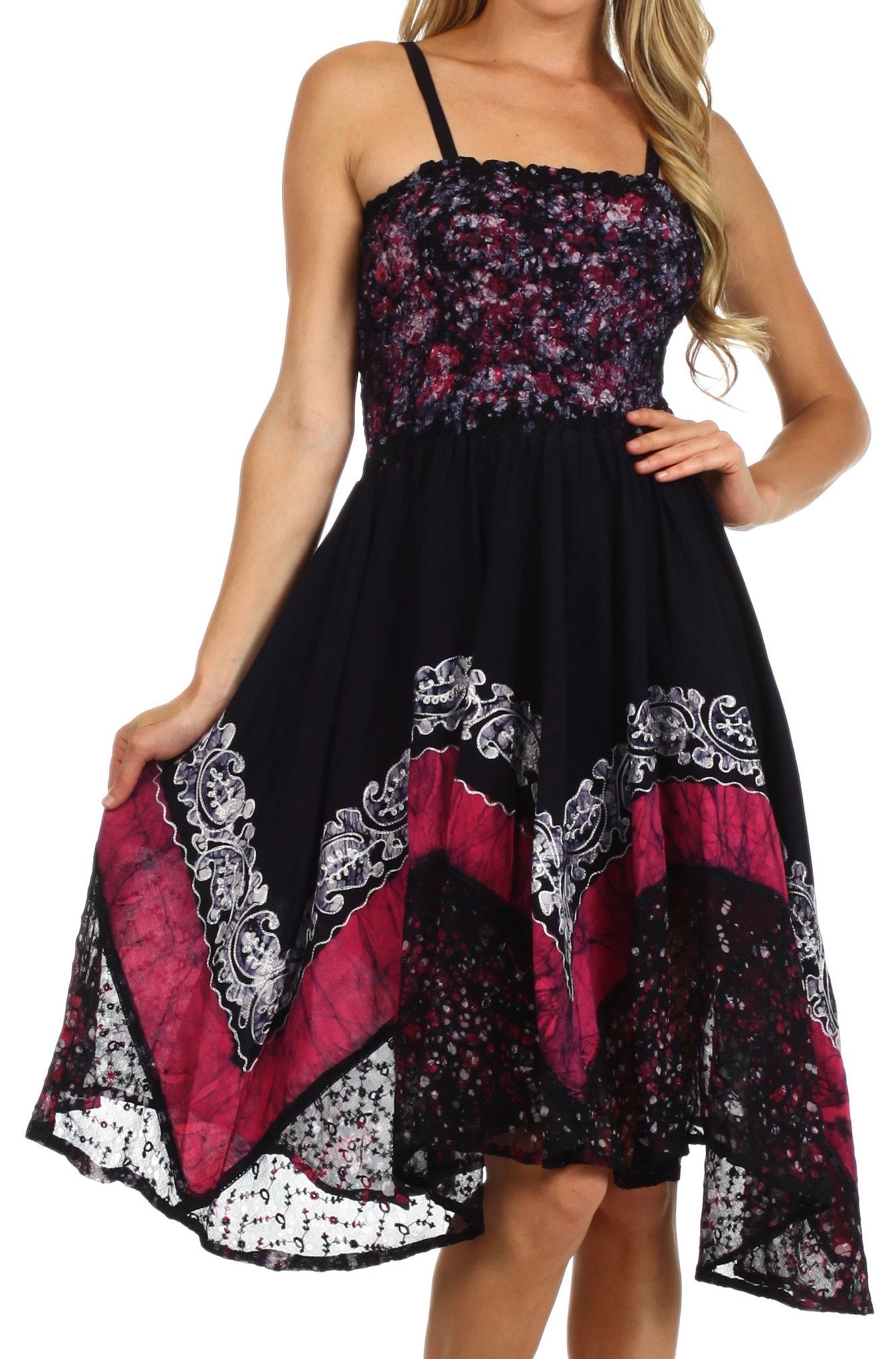 Black dress with floral and geometric patterns worn by a model on a white background